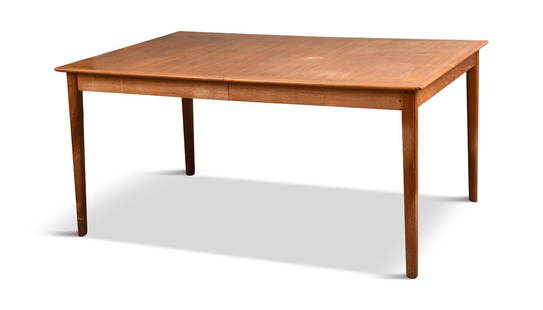 Danish Modern Teak Extension Dining Table by Cado.: Height 27.75 inches, top 59 x 41.5 inches. With three 23.5 inch leaves, total length 10 feet 10.5 inches.