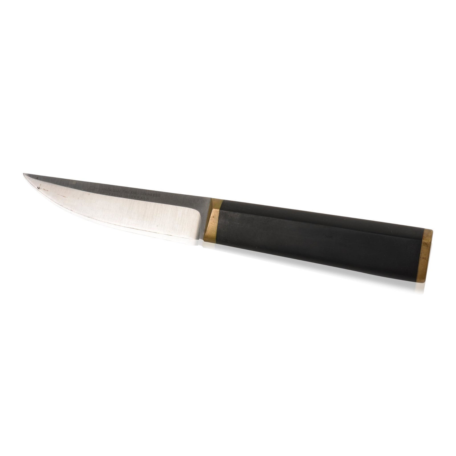 Tapio Wirkkala Puukko Knife, Finland, 1961: Stainless steel, nylon, brass, inscribed â€˜Hackman Finland Stainless Tapio Wirkkalaâ€˜, length 8.75 inches.