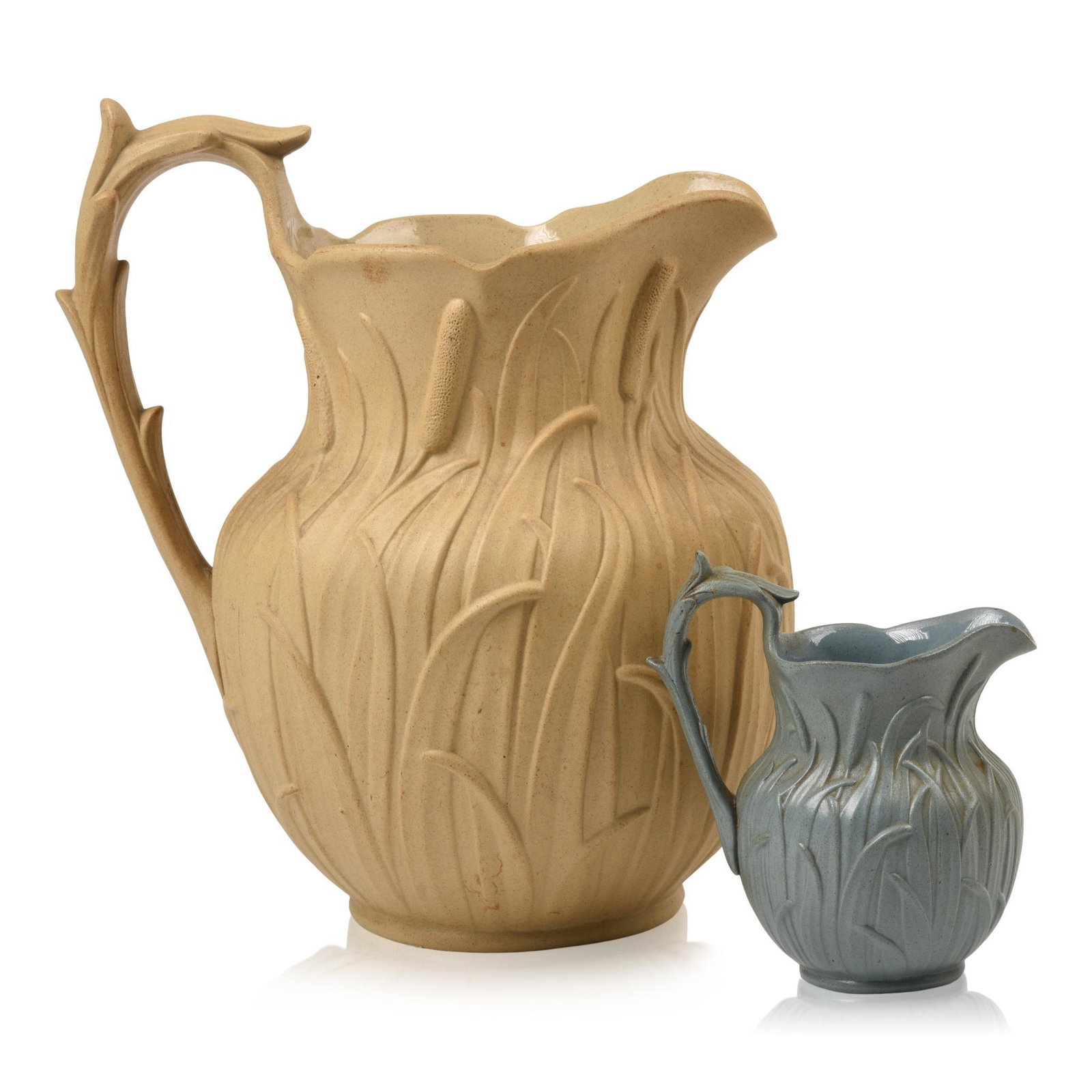 Two Mid Century Cattail Design Pitchers.: Heights 9.5 and 4.5 inches.