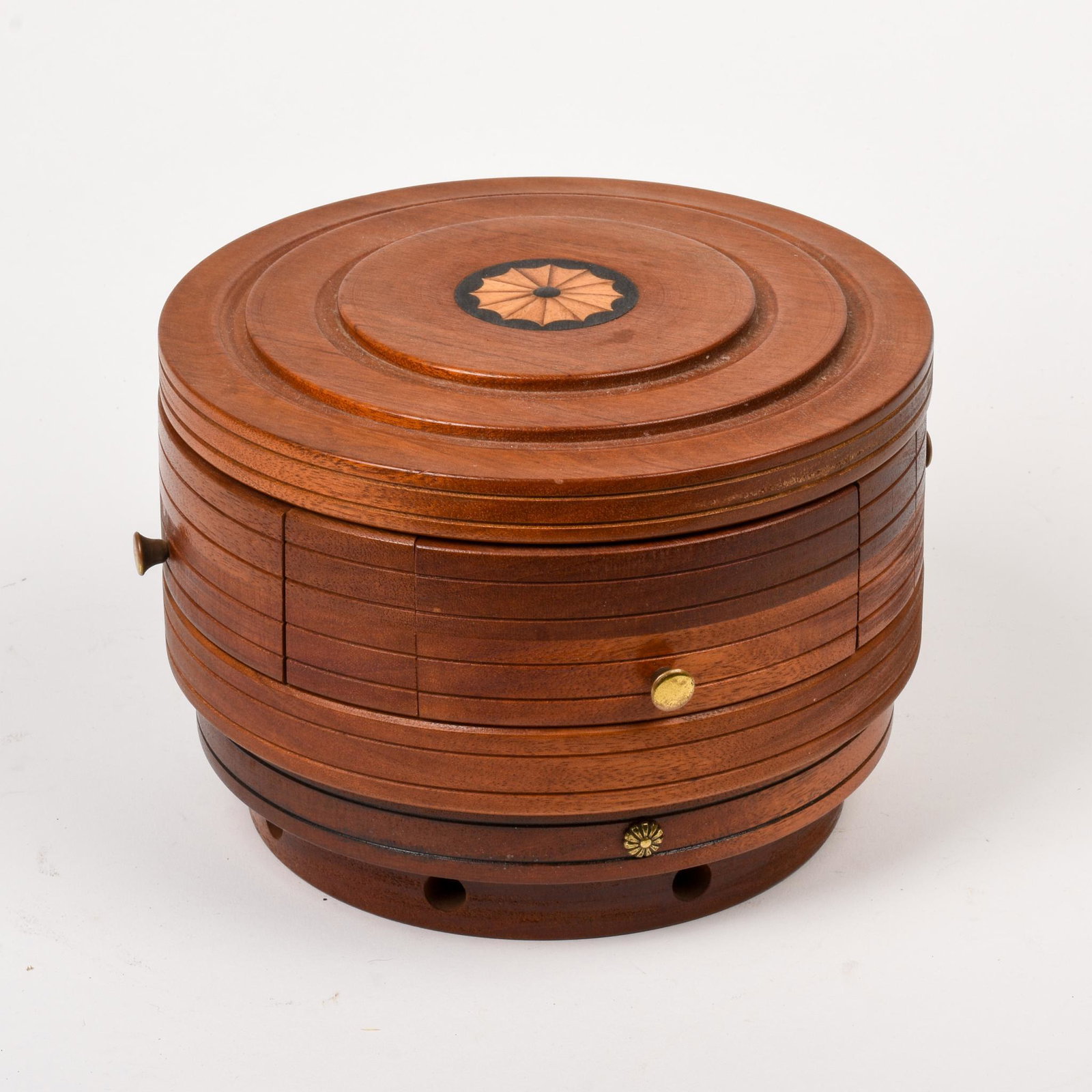 Twentieth Century Mahogany Puzzle Box.: With inlaid pattern at top, height 6.5 inches, diameter 9 inches.
