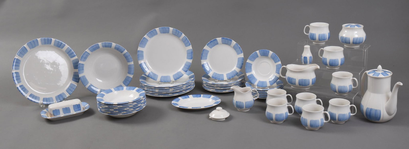 Nikko Japan Lots Pattern Dinner Service for Eight.: Designed by Jaap Penraat Association, 1965. Includes bowls, dinner plates, salad plates, serving platter, serving bowl, teapot, and others. One cup and saucer missing.