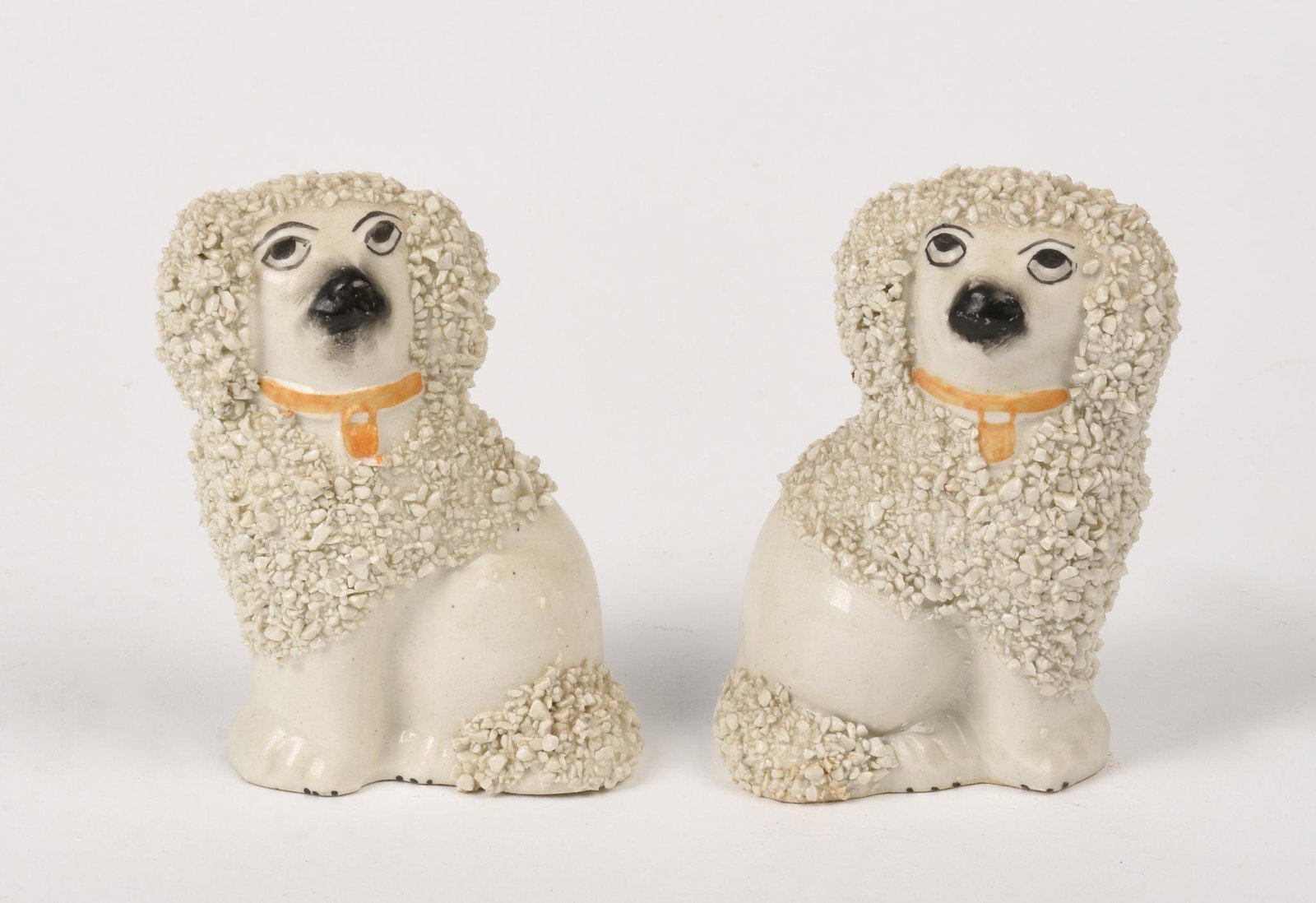 Pair of Miniature Staffordshire Dogs.: Height 3 inches, marked Staffordshire at base.