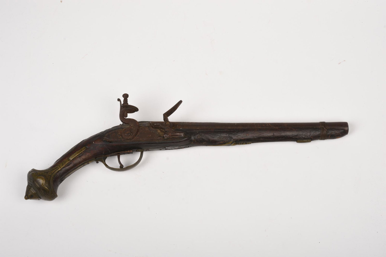 Flintlock Pistol, Near Eastern or Indian.: Length 19 inches, in relic condition.