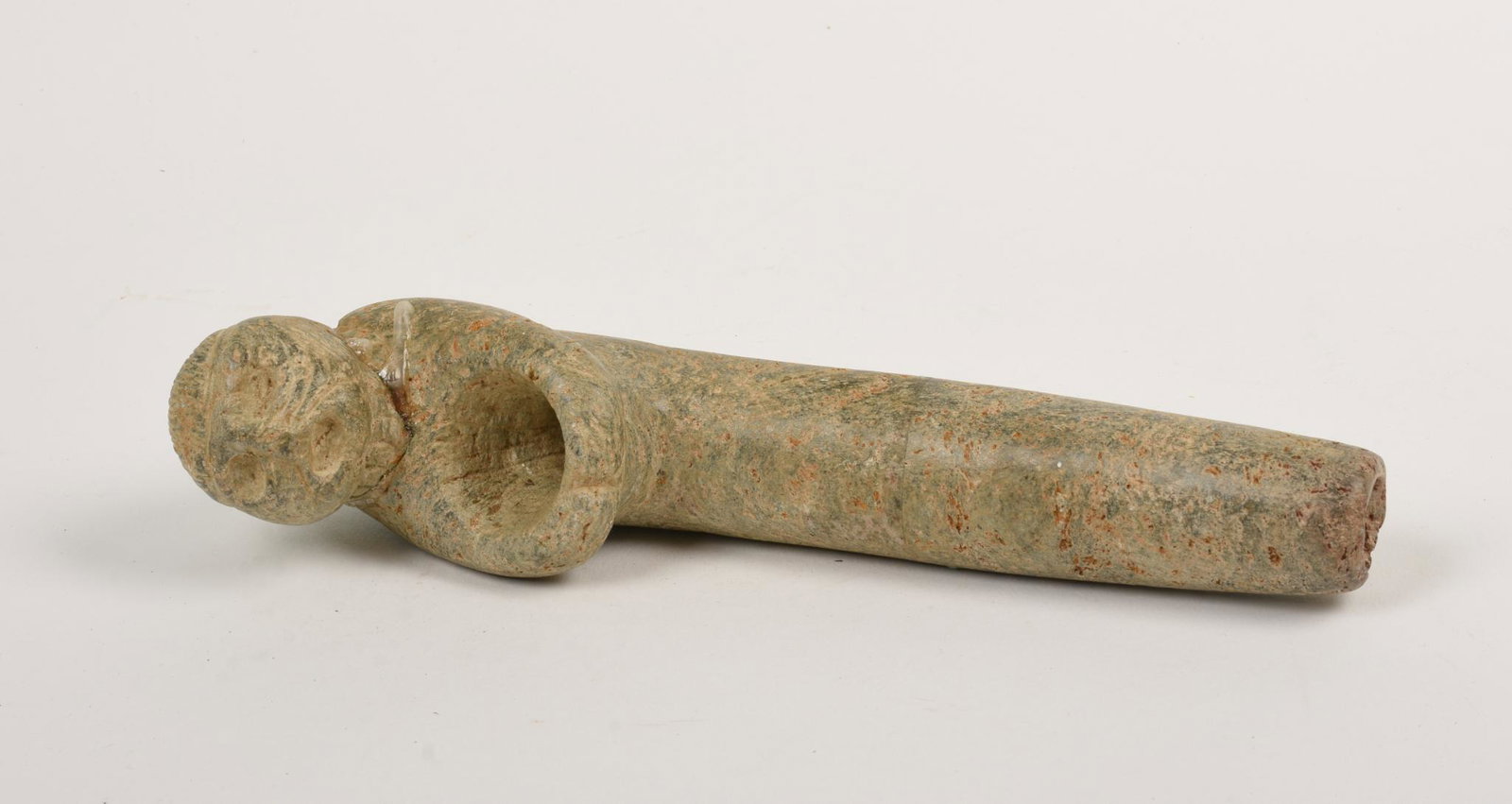 Carved Stone Inuit Pipe.: Length 8.5 inches, repaired break.