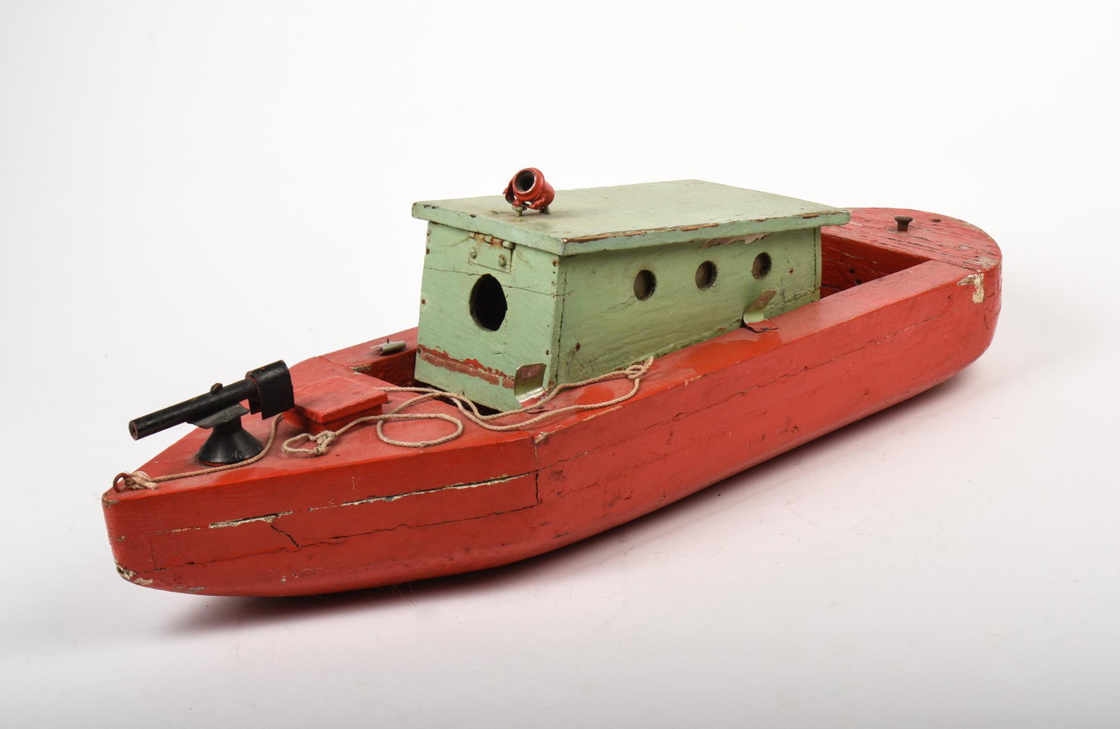 Folk Art Boat Model.: With bow mounted gun and spotlight, length 27 inches.
