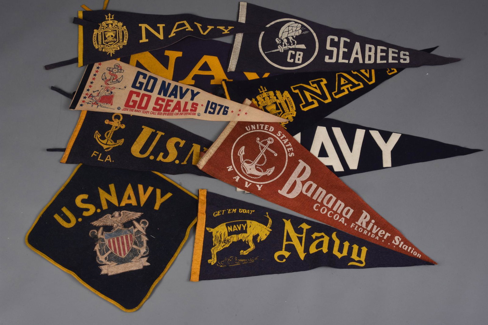 Ten Vintage Navy Penants.: Includes one Seabees, all approximately 26 inches long.