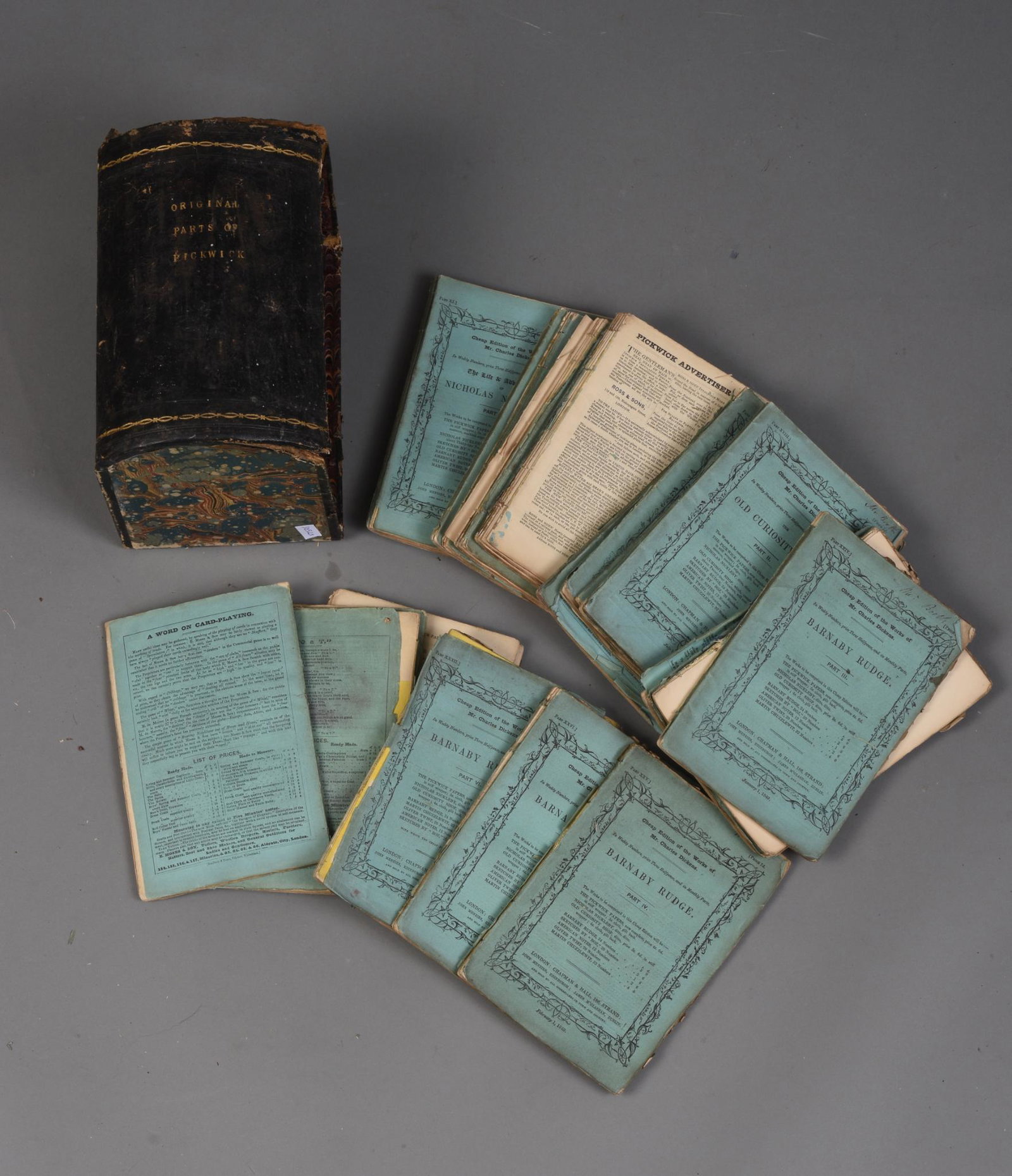 Group of Champan & Hall Charles Dickens Cheap Editions.: Twenty Two Books, in a box marked 'Original Works of Pickwick' Damages and losses.
