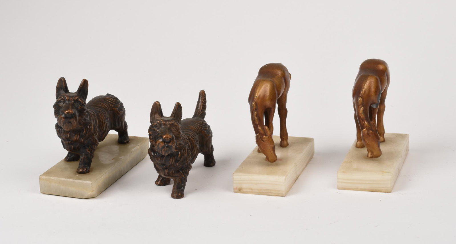 Two Pairs of Metal Animal Sculptures.: Scottie Dogs, length 6.5 inches, and horses. One dog lacking base, one horse with broken tail.