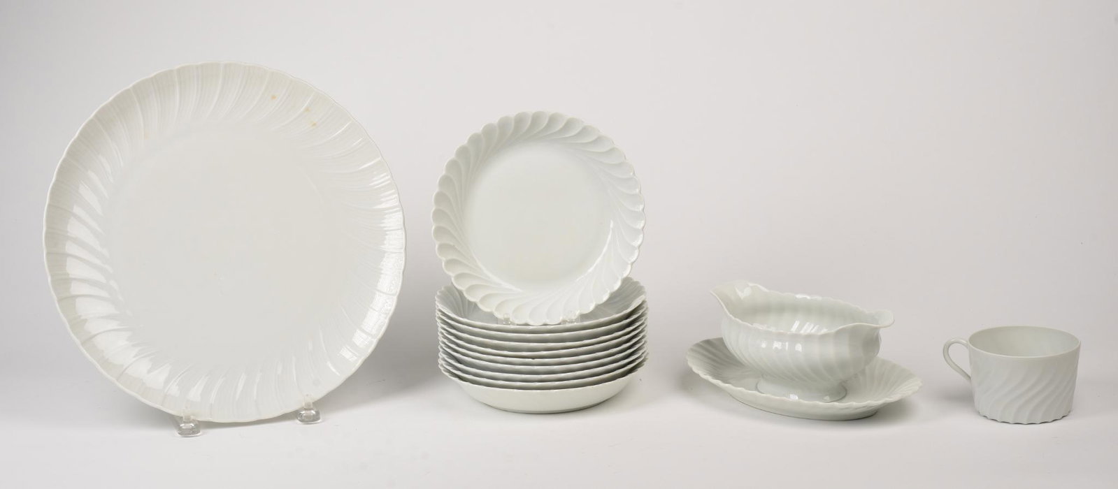Group of Haviland Torse White Pieces.: Serving dish, diameter 12.5 inches, 10 small bowls, a mug, and a gravy boat.