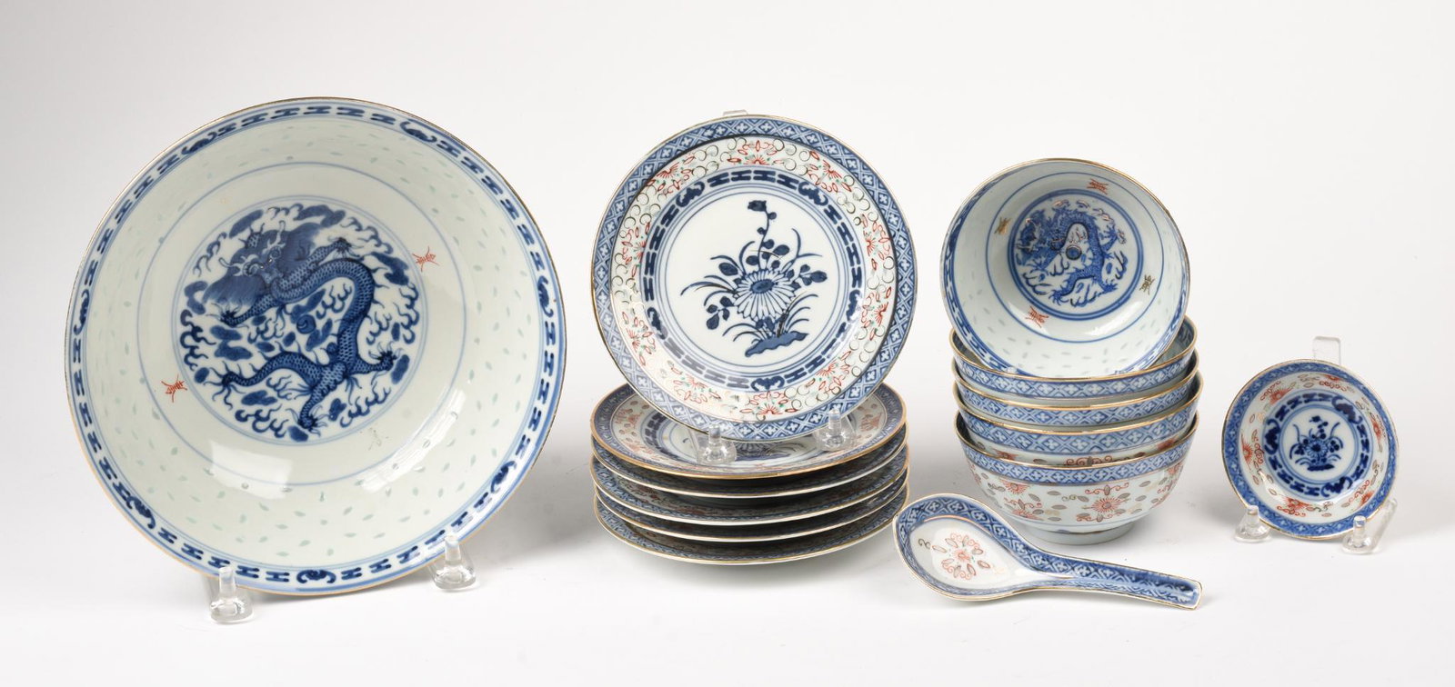 Group of 20th Century Chinese Porcelain.: A bowl, diameter 9.25 inches, six small plates, five small bowls, a spoon and a miniature plate. Chip to rim of one bowl.