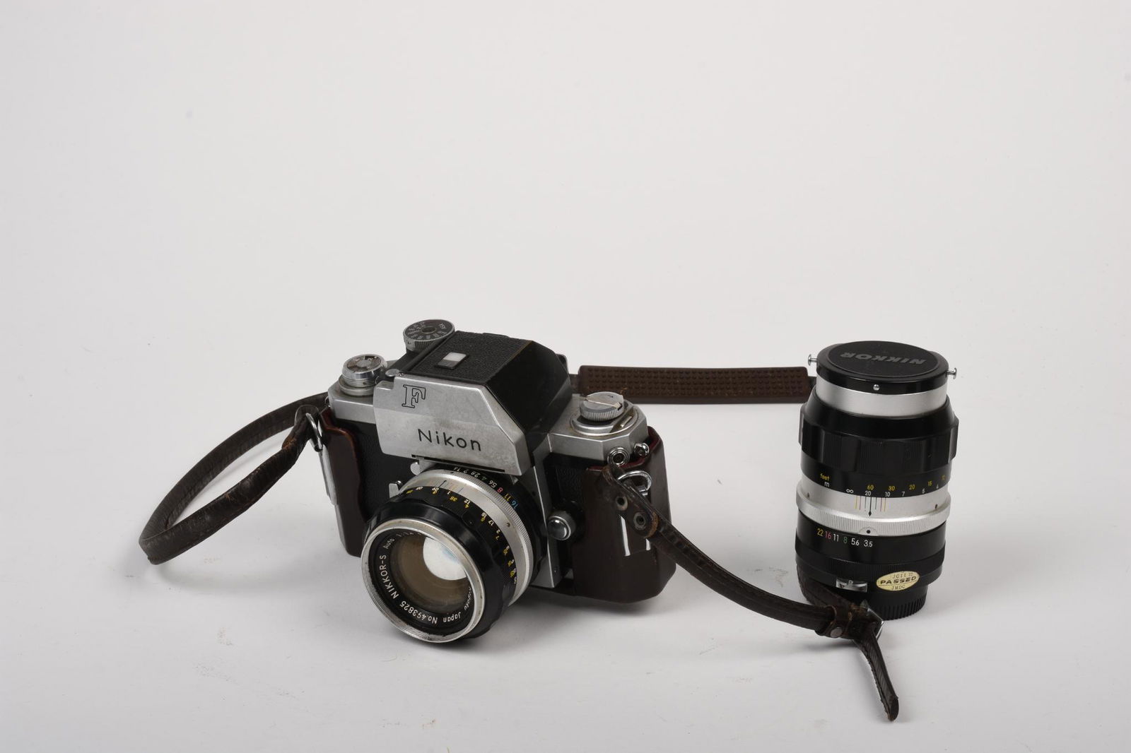 Nikon F Camera and Two Lenses.: Includes Nikkor-S 50mm f1.4 and Nikkor-Q 135mm f3.5. Aperture rings on both lenses operate smoothly, camera is untested. Sold as is, no warranty.