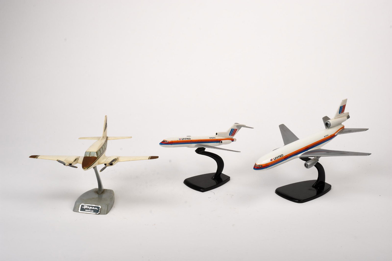 Three Model Airplanes.: Two United Airlines jets, lengths 9.5 and 11 inches, and a Piper Navajo.