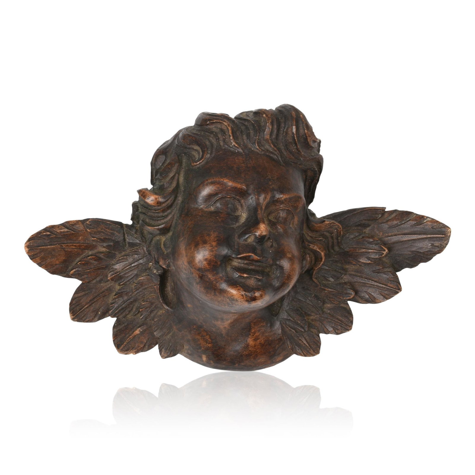 Continental Carved Hardwood Cherub.: Height 6 inches, width 11 inches, mid 19th century.