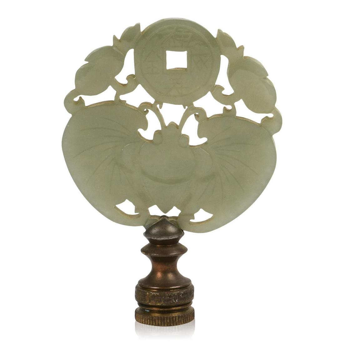 Chinese Carved Jade Plaque: Depicting a butterfly with coin and peaches, 19th c., mounted as a lamp finial, diameter 2.25 inches.