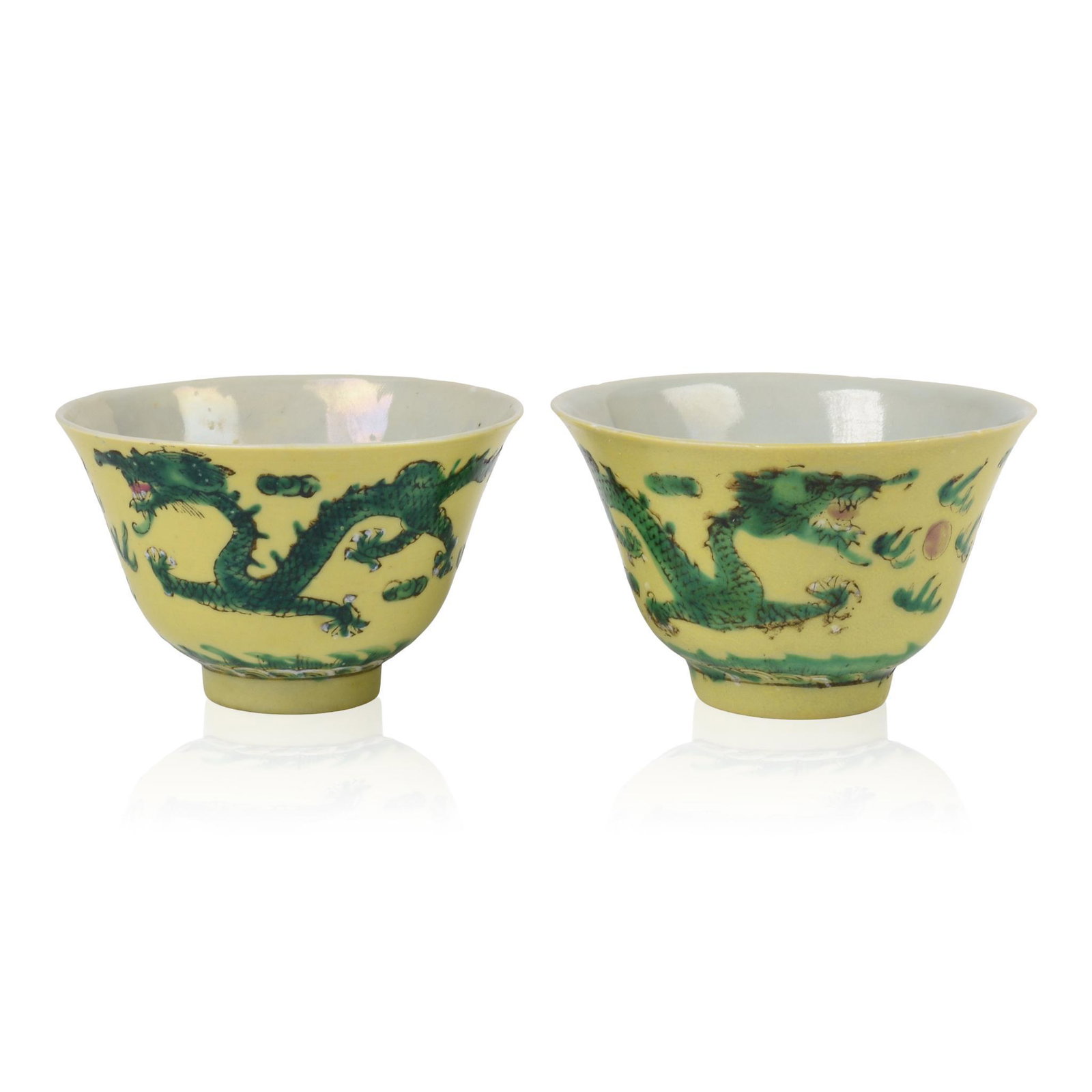 Pair of Chinese Yellow Ground Porcelain Dragon Bowls: Possibly Straits Chinese, both with dragons in green against a yellow ground, each with Tongzhi mark, Nyonga, Peranakan, 19th c., height 2.25 inches, diameter 3.375 inches.