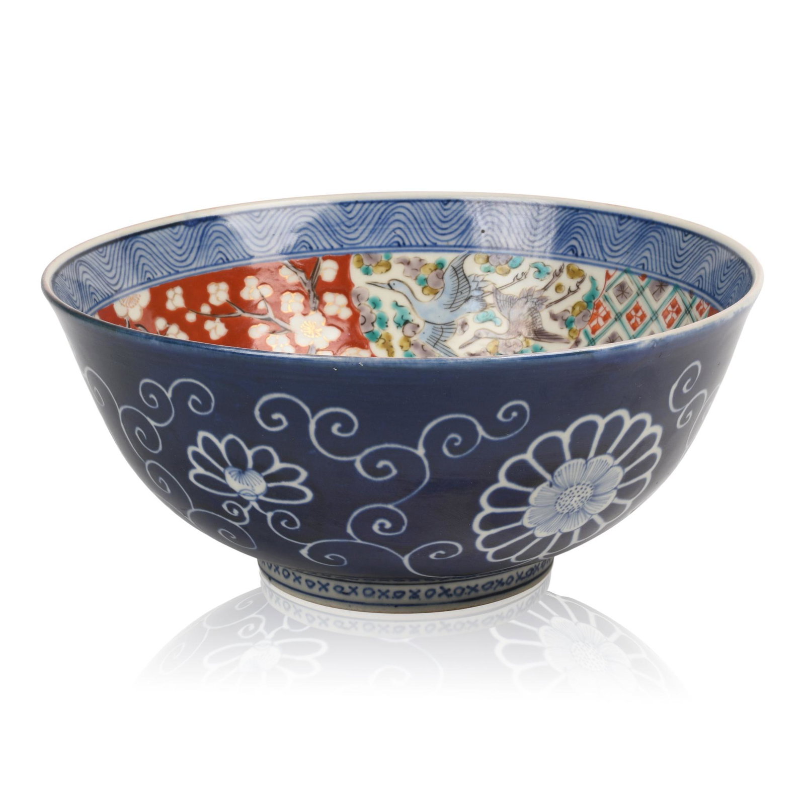 Imari Porcelain Bowl.: Decorated with panels of birds and flowers on a prunus blossom ground, underglaze blue exterior, signed with two character mark, late 19th/early 20th c. Diameter 9.75 inches.