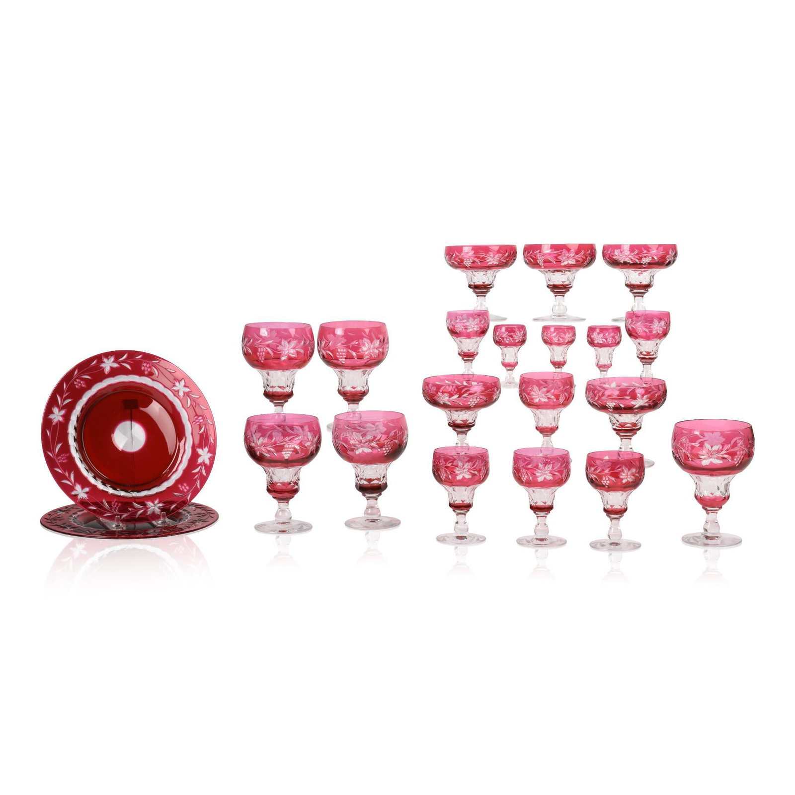 Collection of Grape and Leaf Pattern Cranberry Glass.: Five water goblets, height 5.5 inches, five sherbets, four wine glasses, three sherry glasses, three liqueurs, and two plates, diameter 8.5 inches. One glass has clear breakage and repair. (21)