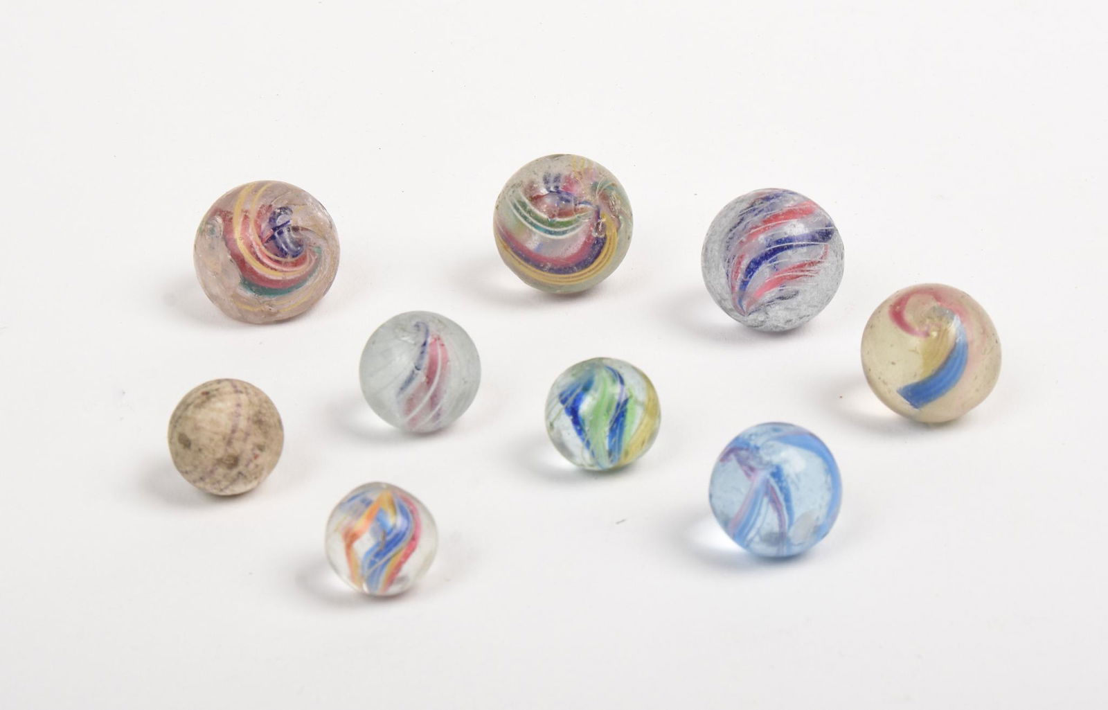 Group of Antique Marbles.: 8 glass and 1 clay, diameters .5 to 1 inches.