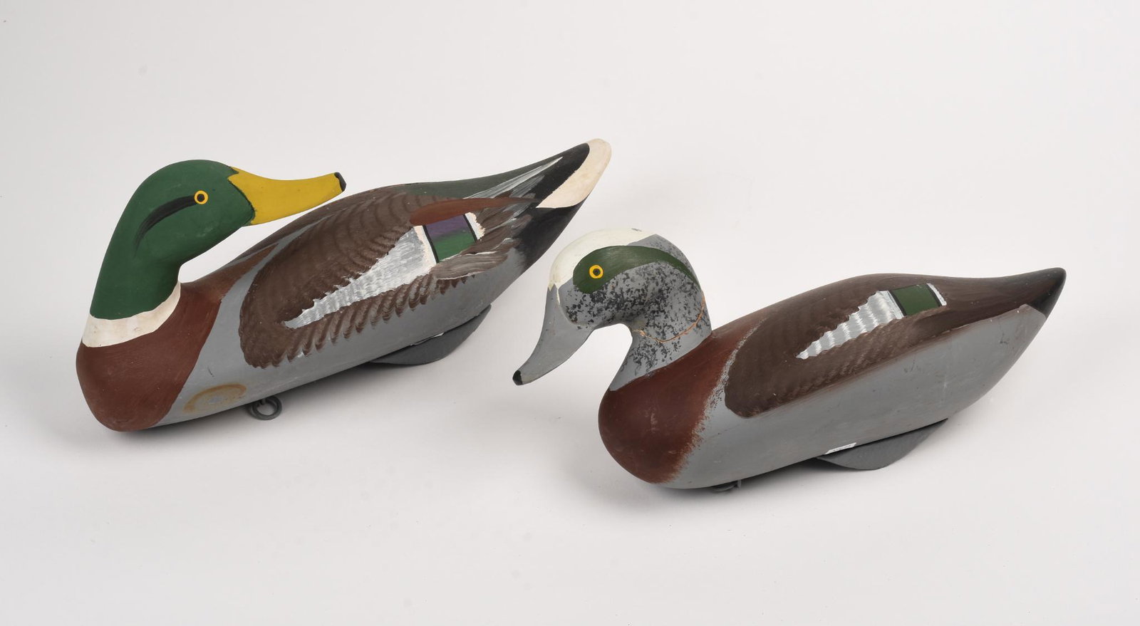 Pair of Capt. Harry Jobes Carved and Painted Duck Decoys: Length 13.5 inches.