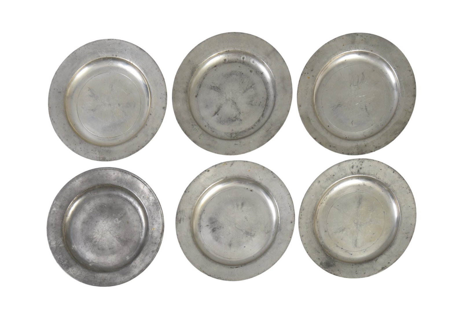 Six 18th Century London Pewter Chargers.: Rubbed marks, makers unknown, diameter 15.75 inches.