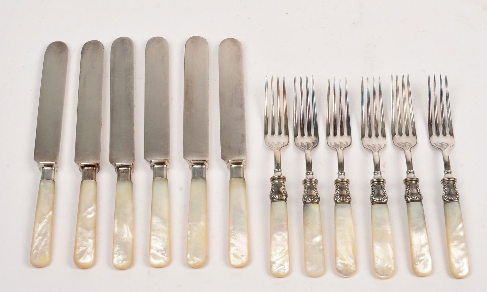 Mother of Pearl Handled Forks and Knives: Six forks and six knives, length of knives 8 inches.