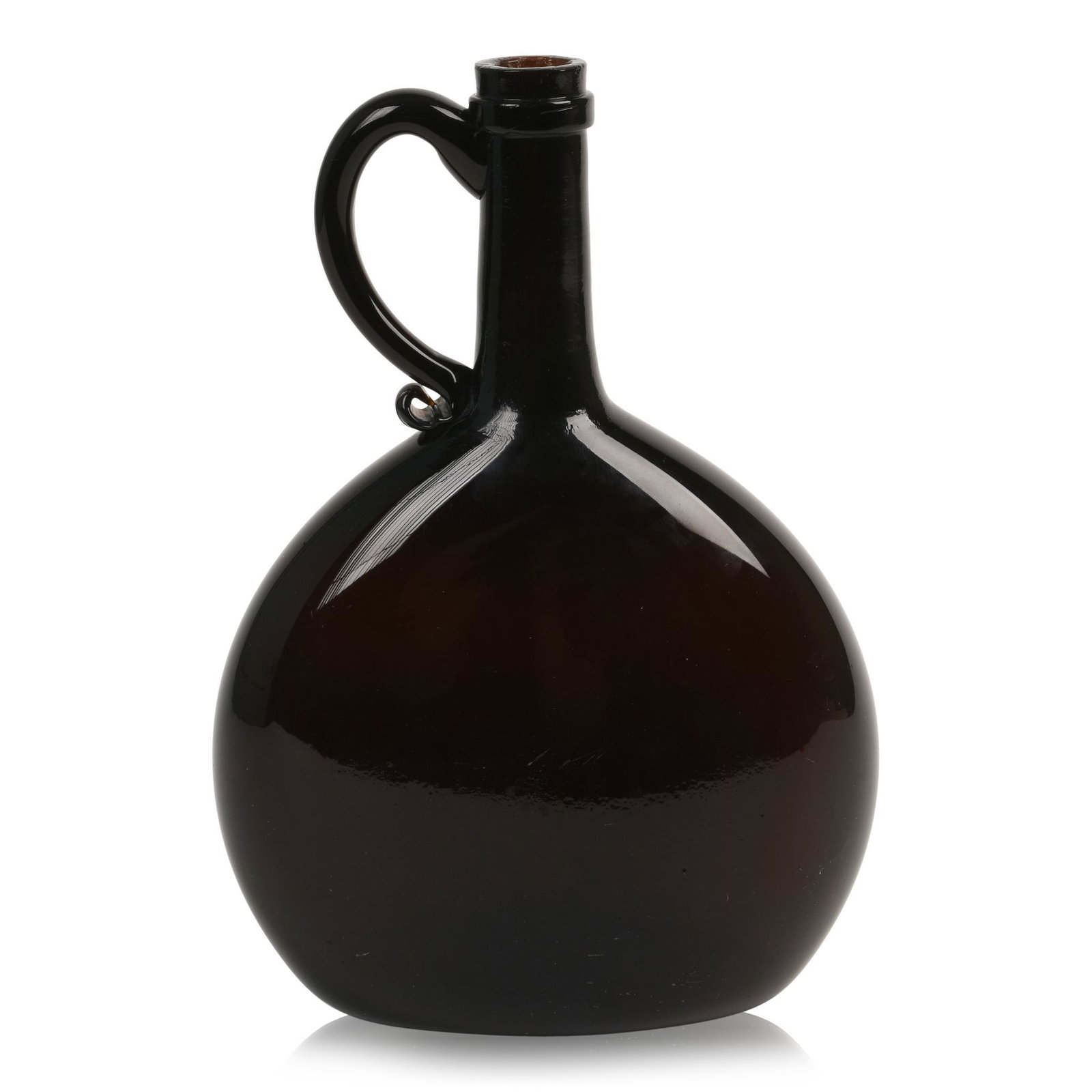 Handled Chestnut Flask: Free blown dark amber glass with applied ring lip and handle, concave base with rough pontil, mid 19th century. Height 8.75 inches.