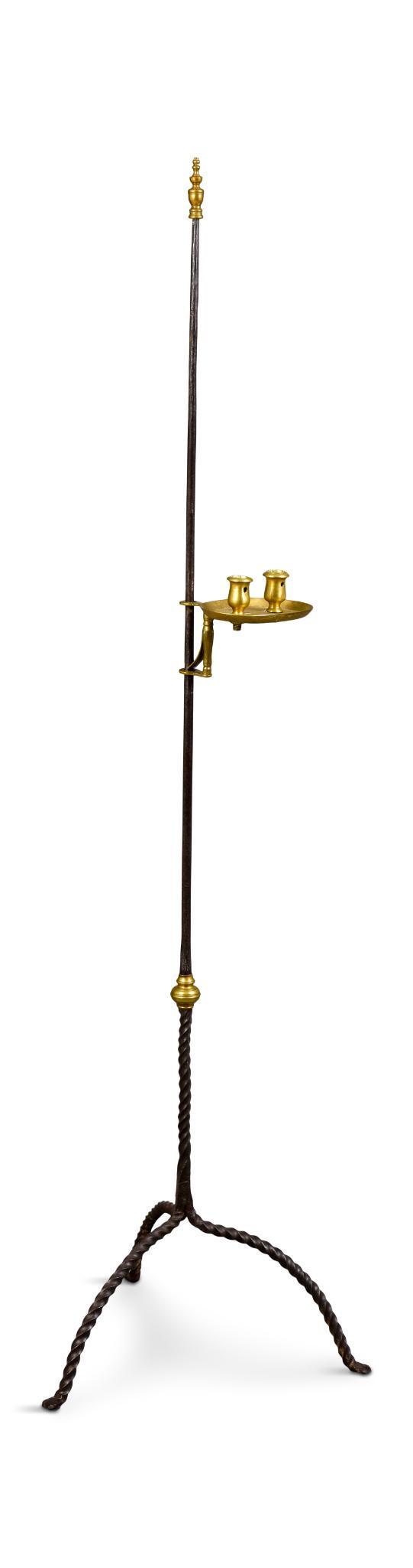 18th Century Iron and Brass Adjustable Candlestick.: With rope twist base, overall height 61.5 inches.