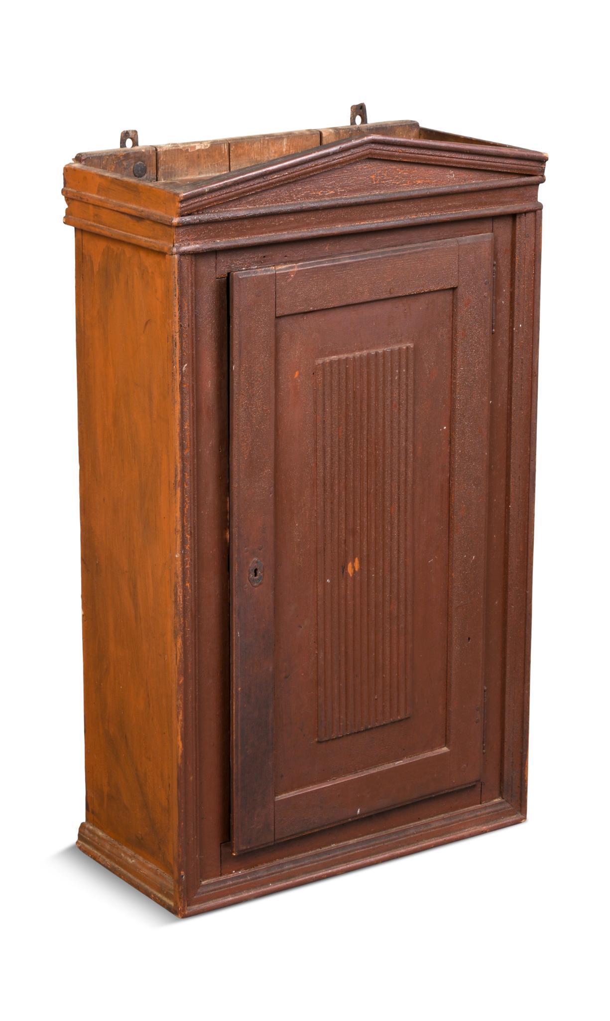 New England Pine Wall Cupboard in Old Brown Paint.: Height 37.5 inches, width 22 inches, depth 10.5 inches.