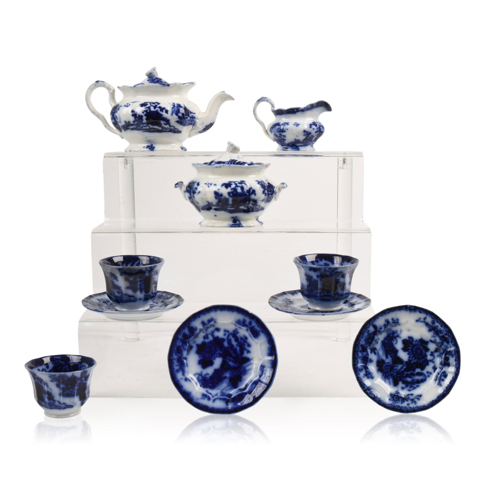 Child's Flow Blue Tea Set: Including tea pot, height 4.5 inches, covered sugar, creamer, four plates and three cups, 19th c.