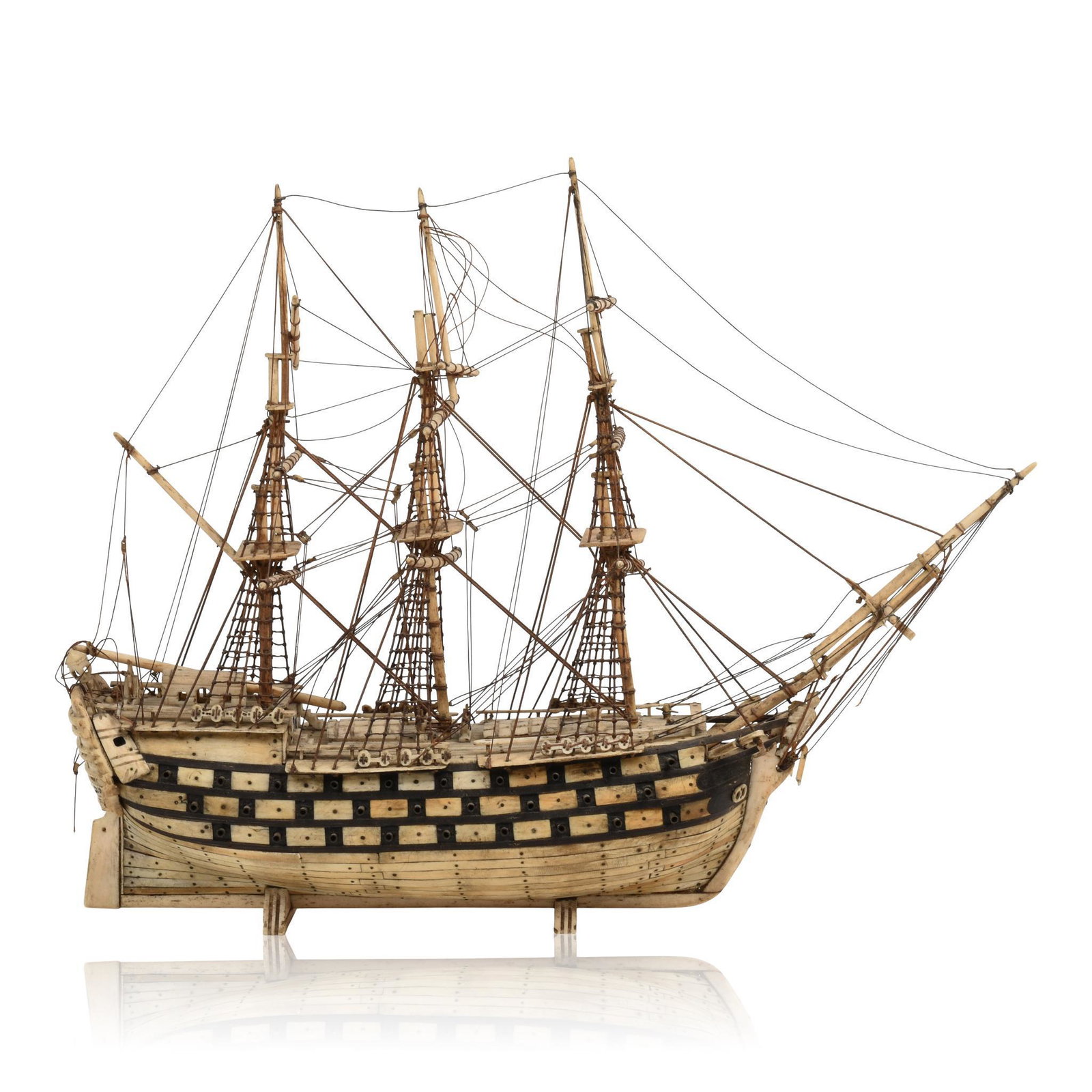 Prisoner of War Bone Model of the War Ship Liberty.: Length 13 inches. Bearing 56 guns, and three masts. HMS Victory was Lord Nelson's flagship in his victory at the Battle of Trafalgar. Breaks to one mast, a section of bowsprit, and some other areas.