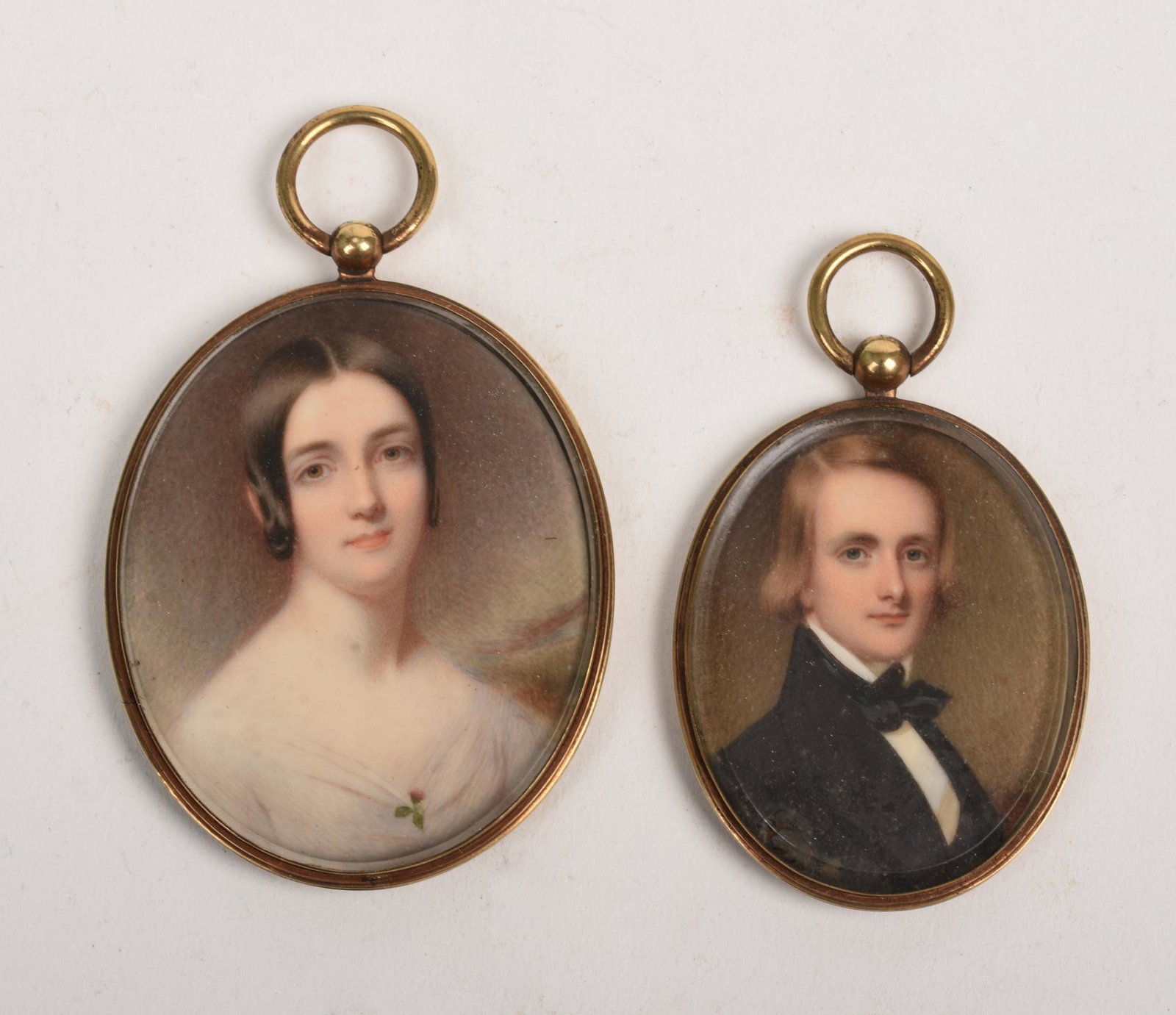Two Miniature Portraits.: In rolled gold cases, 2.75 x 2.25 and 2.25 x 1.75 inches.