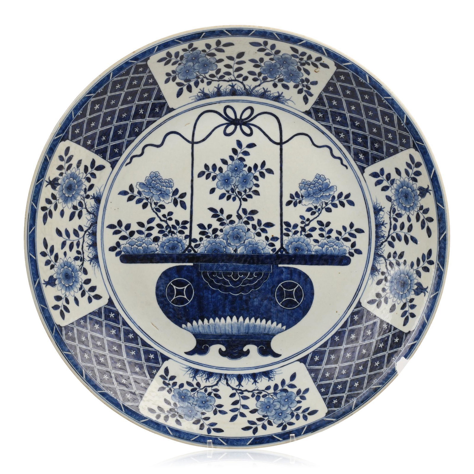 Large Chinese Blue and White Porcelain Charger: Center decorated with a basket of flowers, lattice and flower border, diameter 21.25 inches. Chip to outer rim.