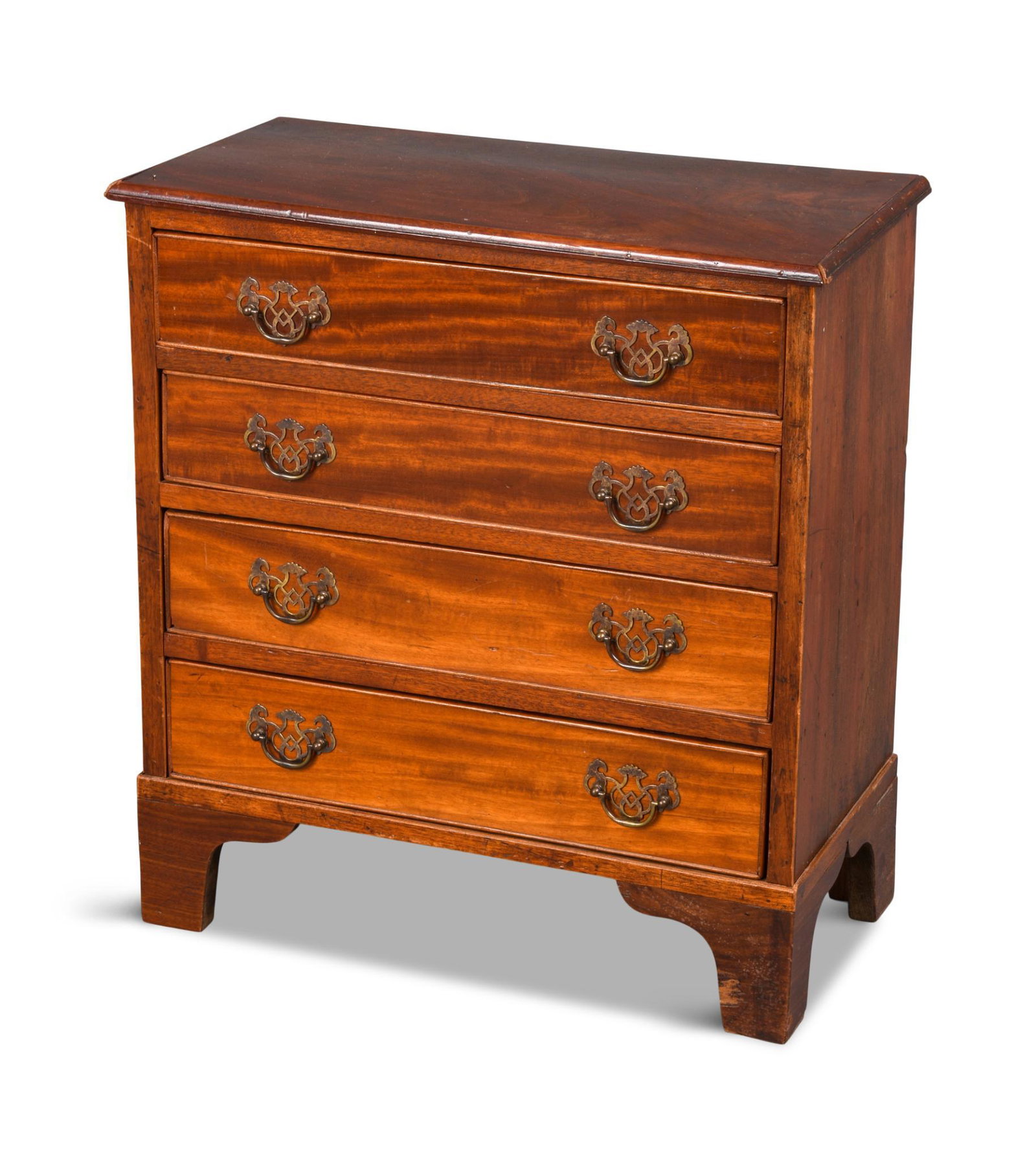 Chippendale Style Child's Chest of Drawers.: The top with applied molded edge above a case of four graduated drawers on ogee bracket feet. Height 23.5 inches, case width 20.5 inches, depth 10.25 inches.