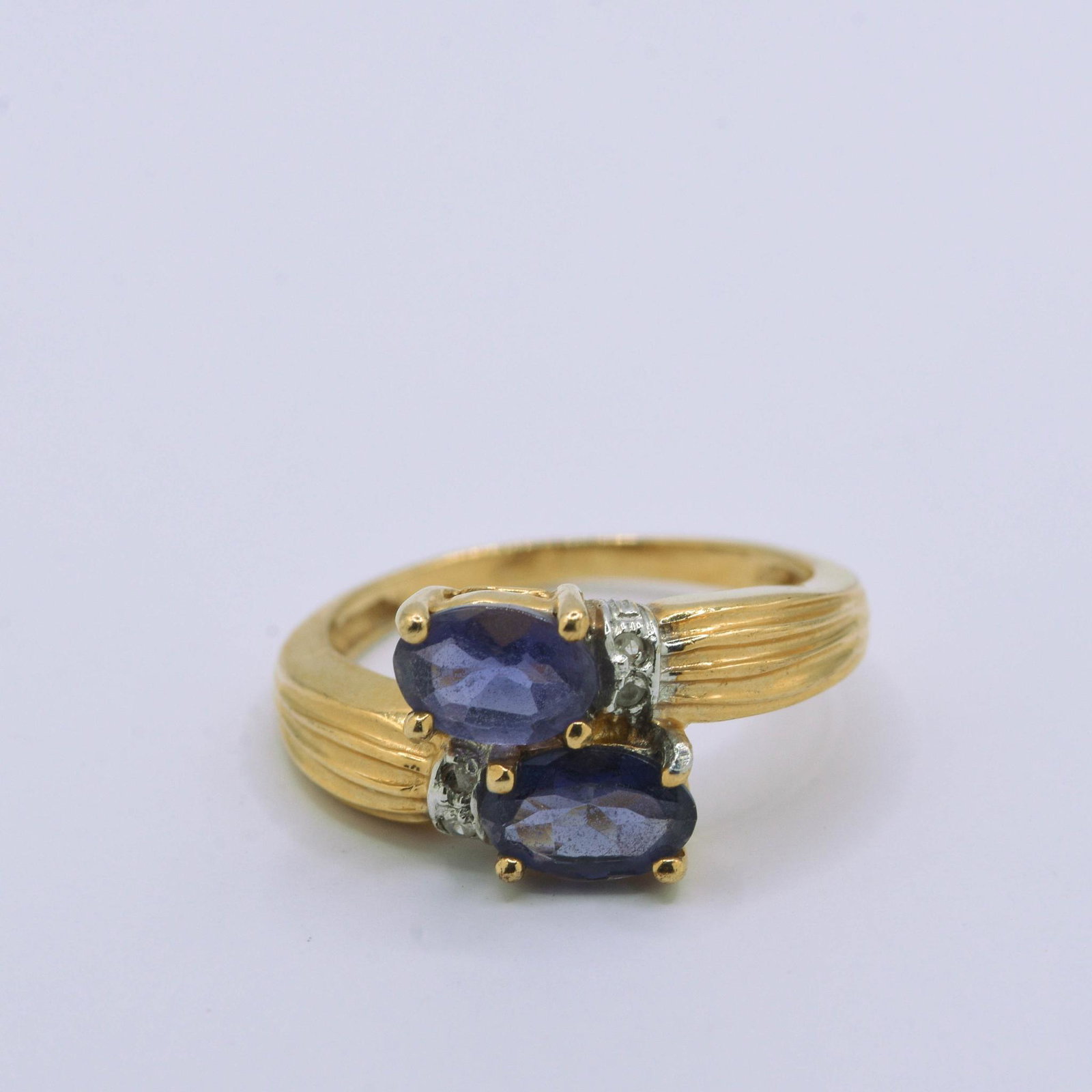 10K Yellow Gold Sapphire & Diamond Ring: 6mm x 4mm Oval Sapphires with .02 cttw Diamond Ring 1.8 grams. Size 3