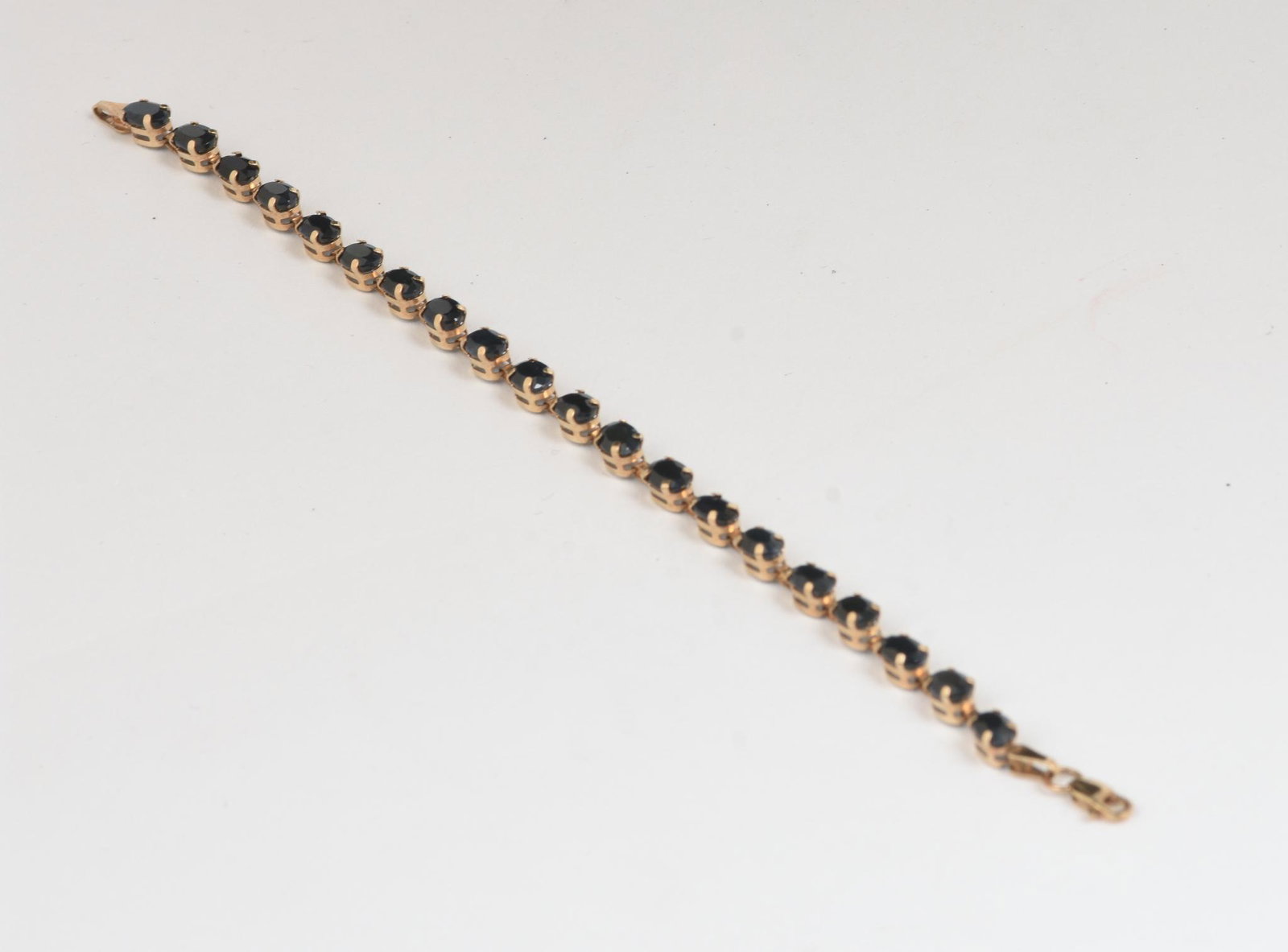 10K Gold and Sapphire Bracelet: Maker's mark JJT length 7 inches, 5.2 grams.