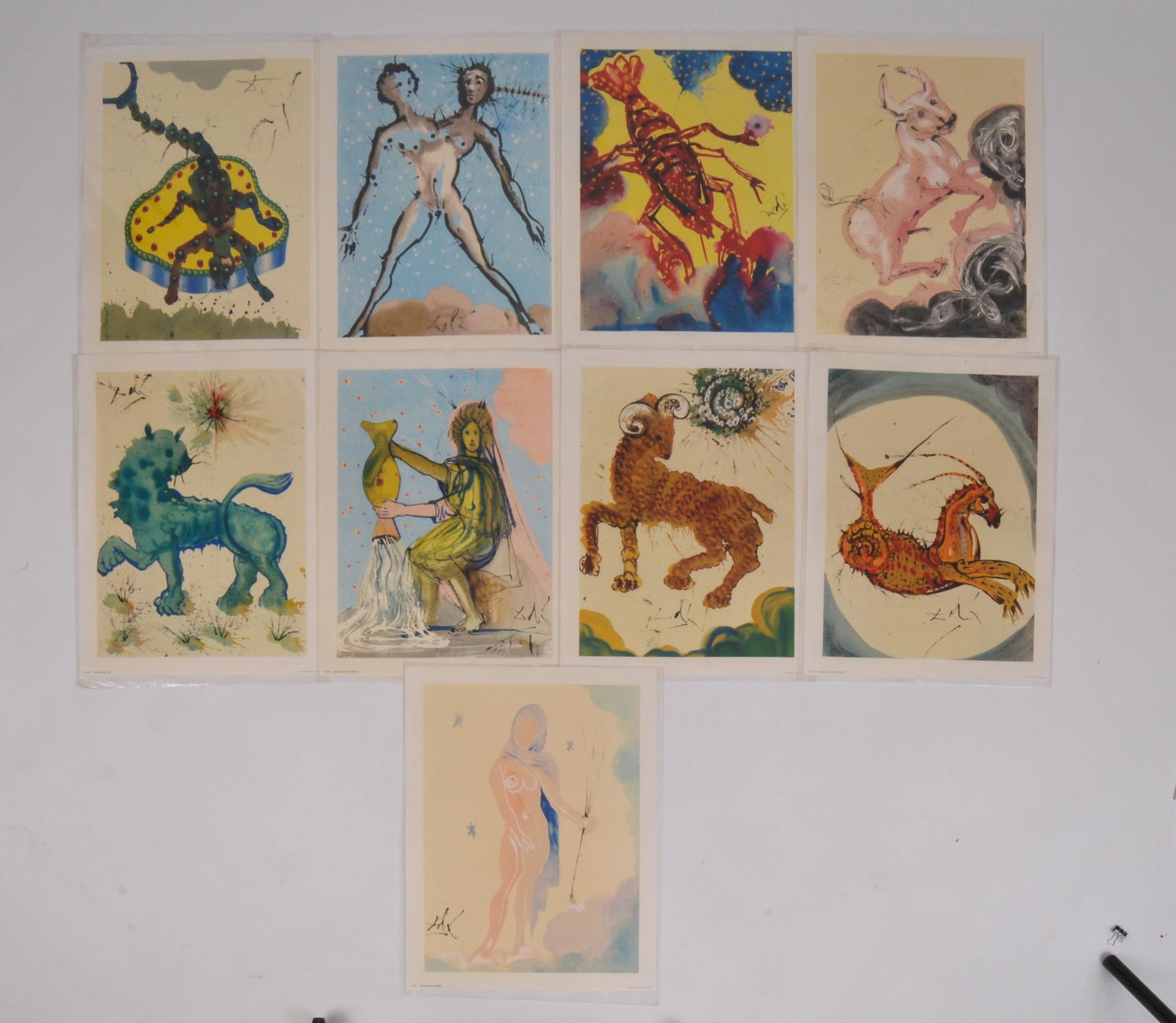 Nine Salvador Dali Zodiac Prints by Penn Press, 1972: Each 18 x 14 inches.