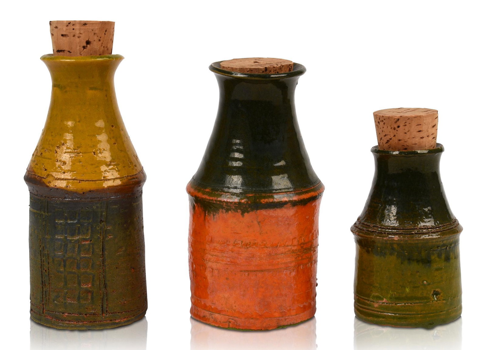 Three Danish Modern Spice Bottles: Heights 4.5, 6.5 and 7 inches.