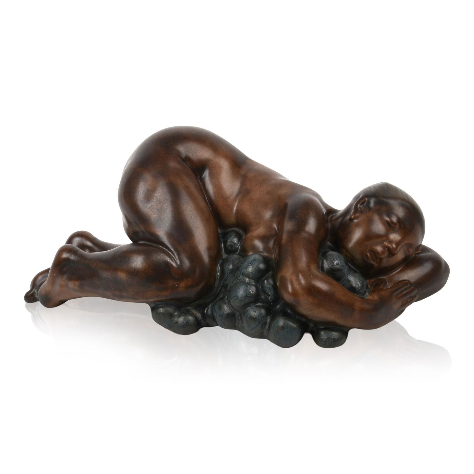 Kai Nielsen Stoneware Figure of Woman with Grapes.: Designed for Bing & Grondahl from his Grape Harvest series, model number 4020, signed with oval three tower mark and inscribed Kai Nielsen 1912. Length 7 inches.