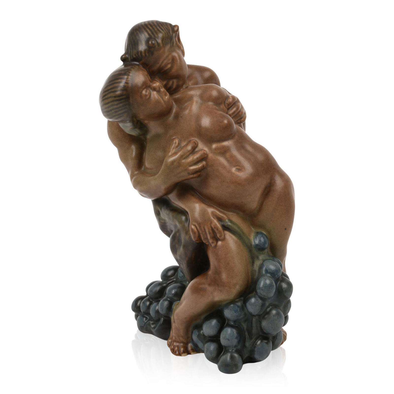 Kai Nielsen Stoneware Figure of a Satyr and a Woman with Grapes.: Designed for Bing & Grondahl from his Grape Harvest series, model number 4023, signed with oval three tower mark, Kjobenhavn, Danmark and inscribed Kai Nielsen 1912. Height 8 inches.