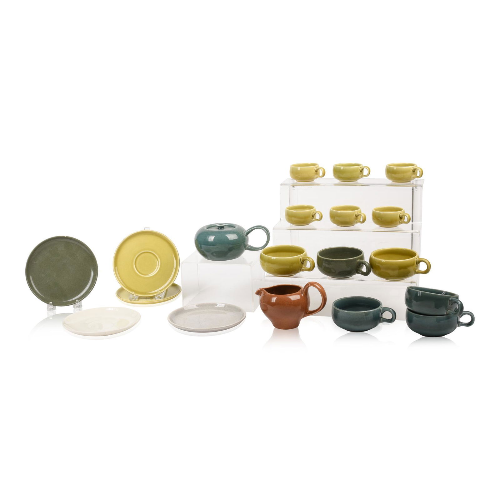 Group of Russel Wright China.: Including Iroquois and Steubenville, Small teapot, gravy pitcher, six cups, five saucers, six espresso cups. Hairline crack to one teacup. 20 pieces.