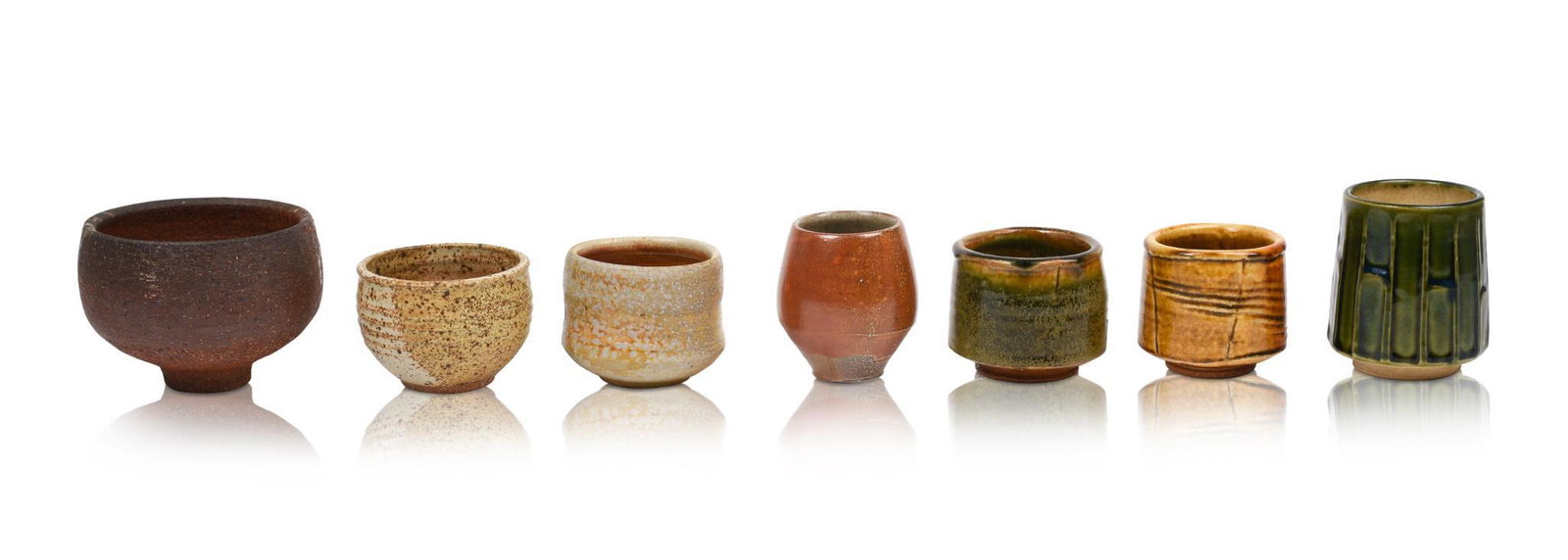 Seven Japanese Yunomi Tea Cups: Heights 2.75 to 4 inches.