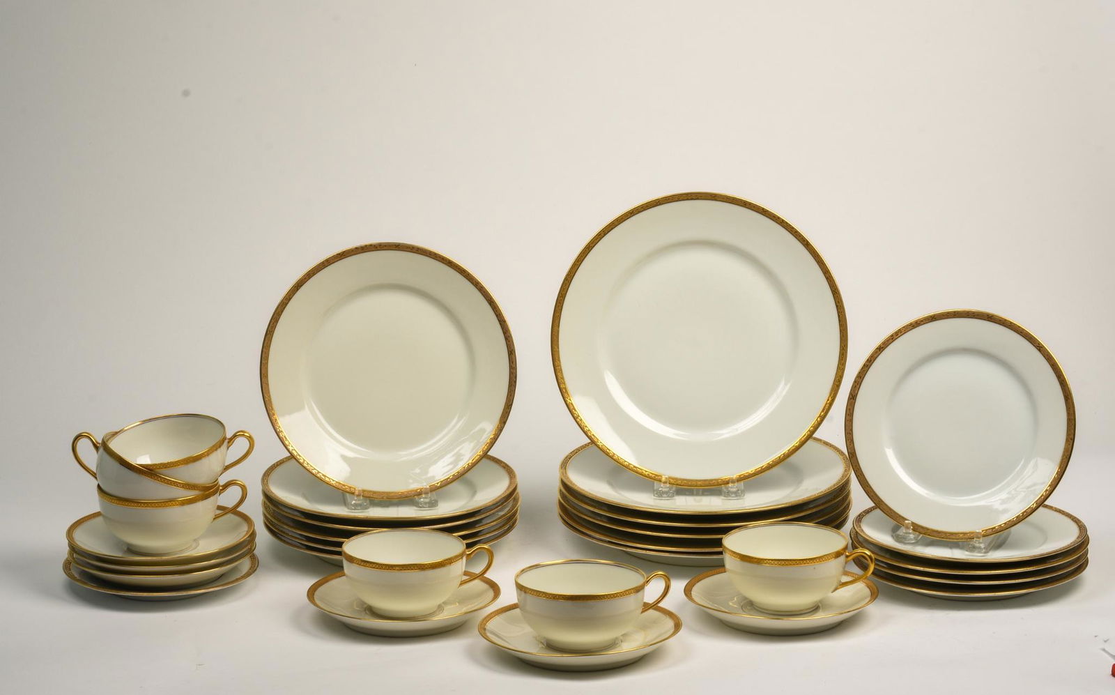 Theodore Haviland Gilt Rimmed Service for Six.: Dinner plates, salad plates, dessert plates, cups and saucers.