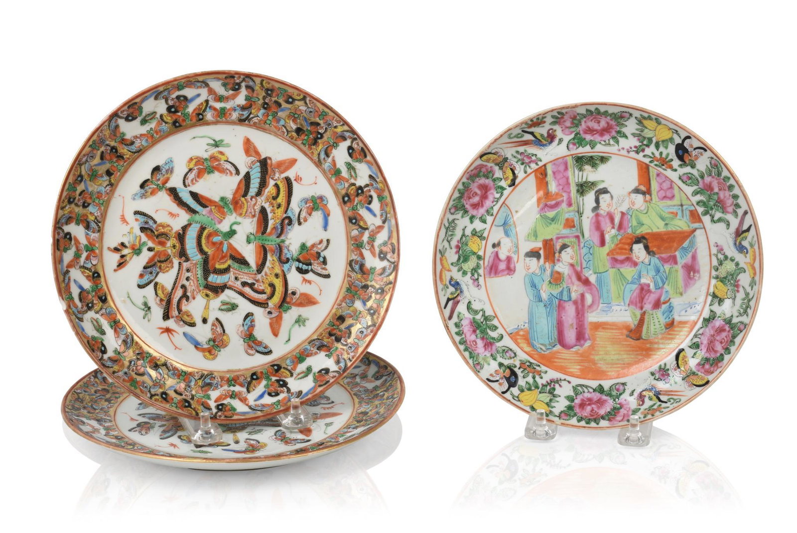 Three Chinese Famille Rose Porcelain Plates.: One plate with a center panel of court figures, a pair decorated with the hundred butterflies pattern, 19th c. Diameter 8 inches of plate with court figures. 8.5 inches diameter of butterfly plates.