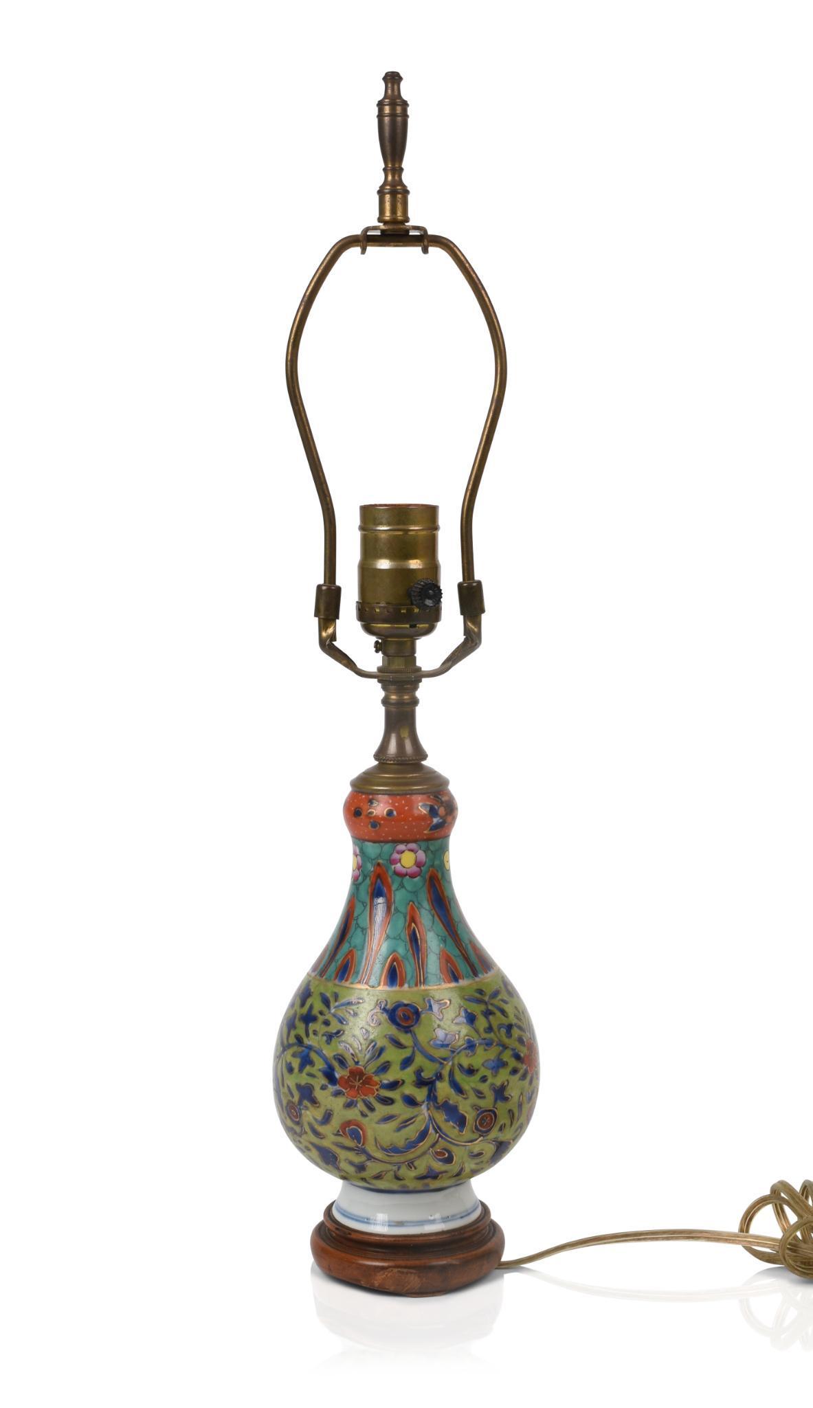 Chinese Famille Rose Porcelain Vase.: Kangxi period, with later clobbered enamels, mounted as lamp. Height of lamp base 7 inches. Overall height 19 inches.