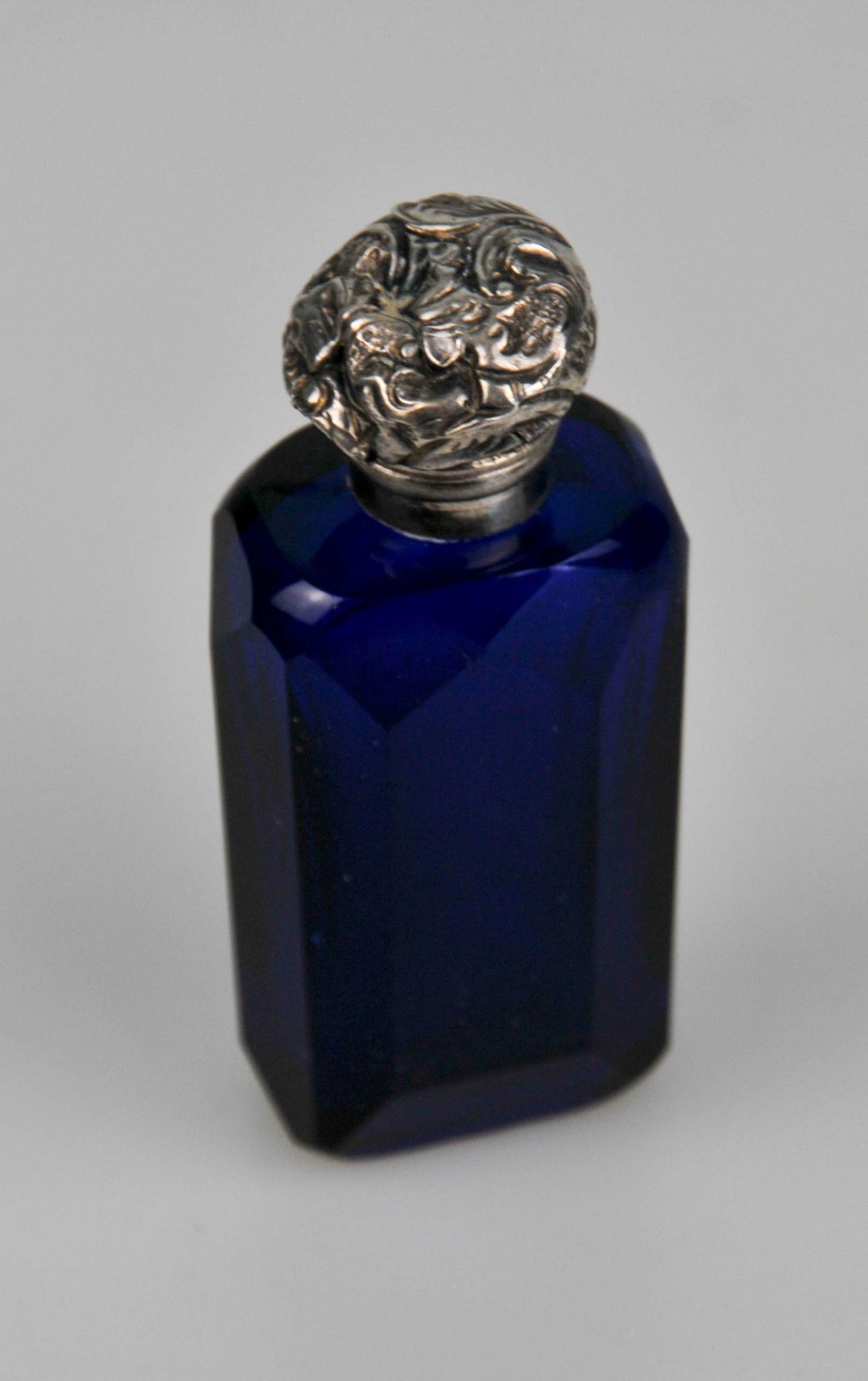 ANTIQUE COBALT BLUE CUT GLASS W SILVER TOP PERFUME BOTTLE: 2 13/16" by 32mm by 22mm silver pushed in tiny chips