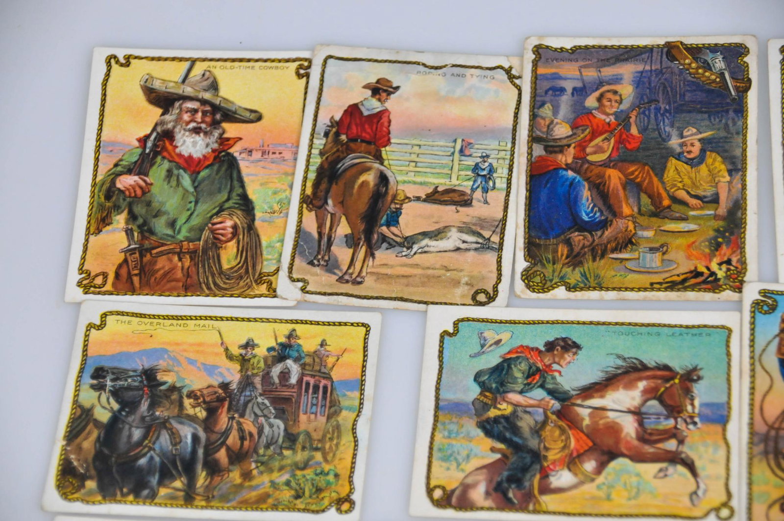 10 1910 HASSAN CIGARETTE TOBACCO COWBOY SERIES CARD LOT: 10 cards from the cowboy series of varying conditions