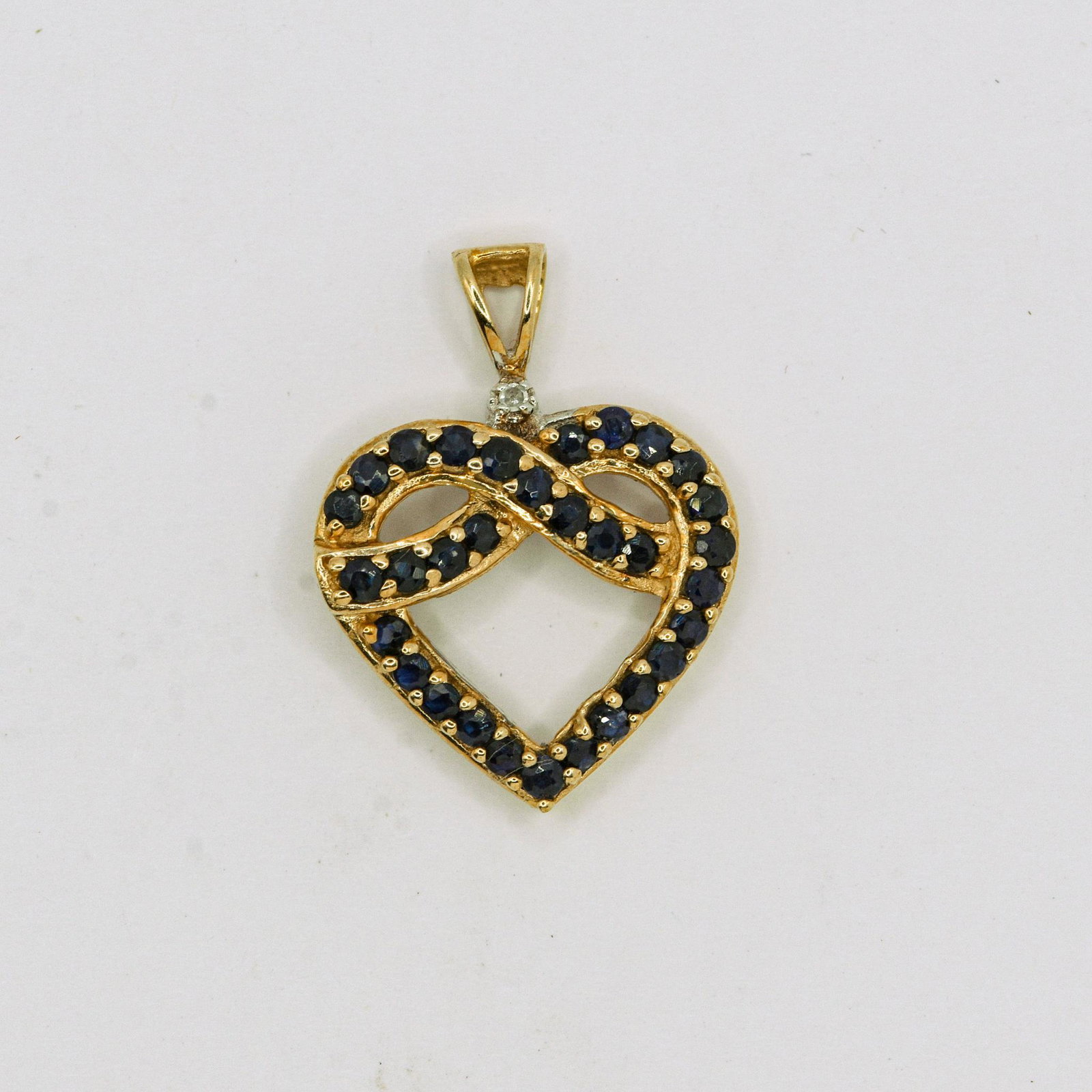 10K Sapphire Heart Pendant: 30) 2mm Round Sapphire Heart Pendant, 1.8 grams