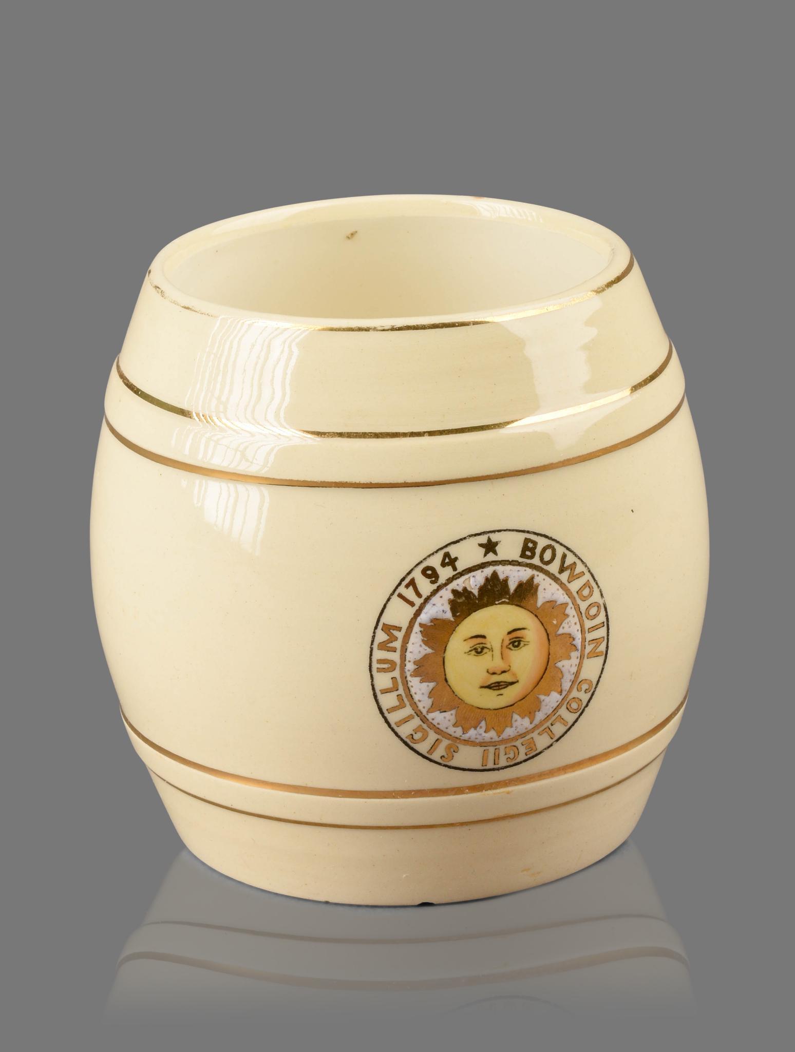 Bowdoin College Barrel Form Mug.: Front decorated with 1794 college seal in yellow and gold, made in Germany c. 1900. Height 4 inches.