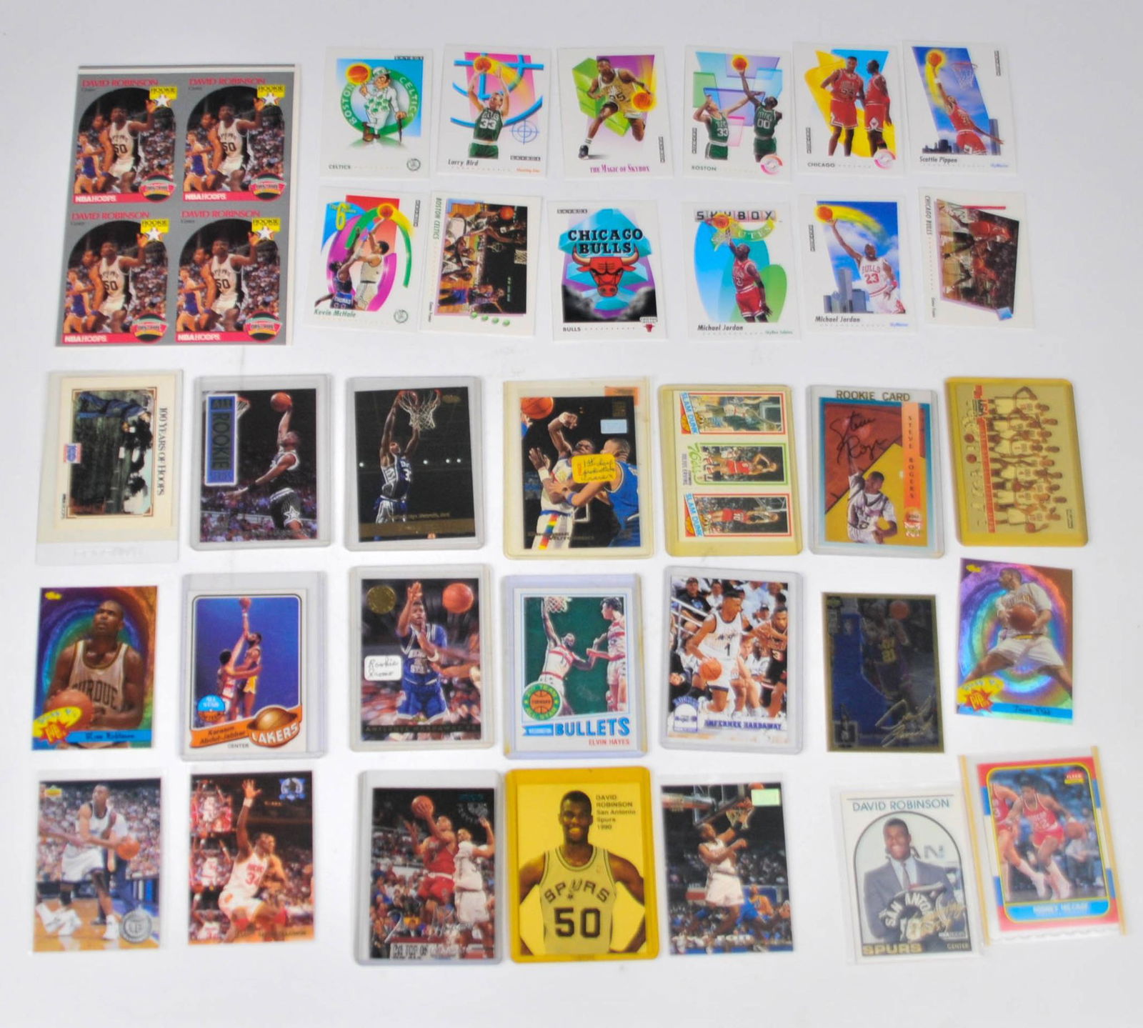 Collection of Basketball Cards.: David Robinson Rookie uncut sheet, David Robinson, Elvin Hayes, 10 1992 Skybox Celtics cards, and others.