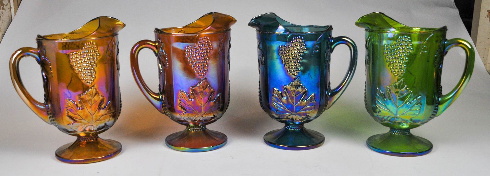 Four Carnival Glass Pitchers. (1 of 2)